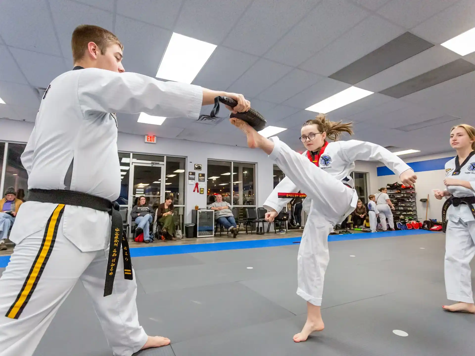 a group of people in karate uniforms