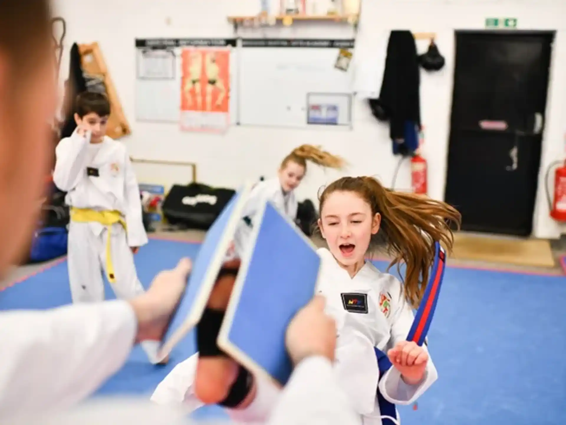 a group of people in karate uniforms