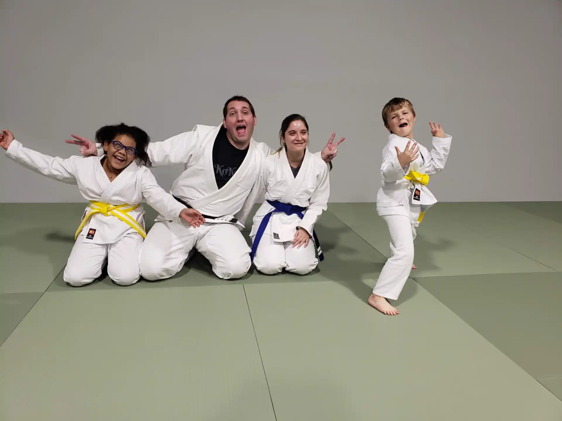 a group of people in karate uniforms
