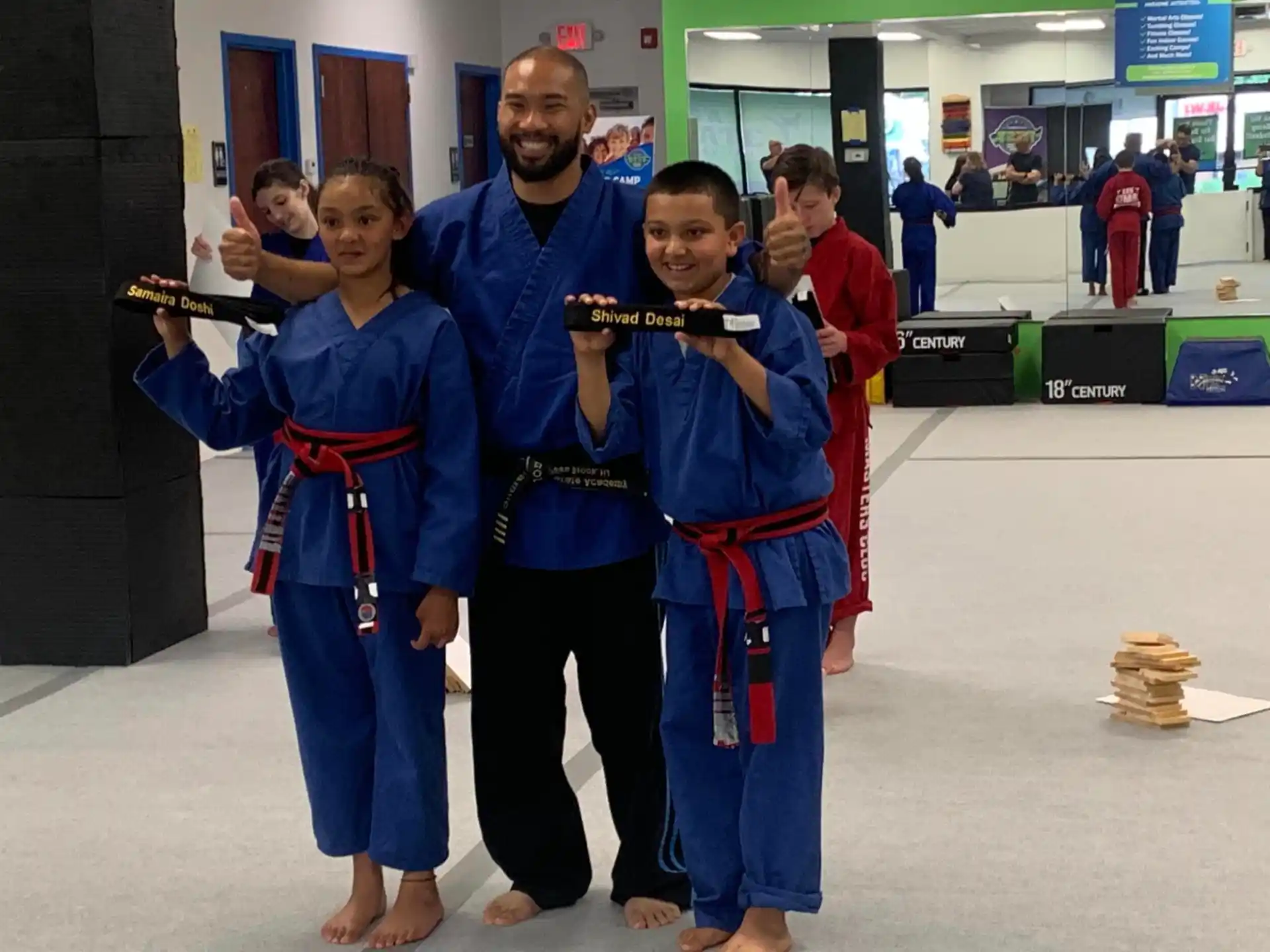 a group of people in karate uniforms