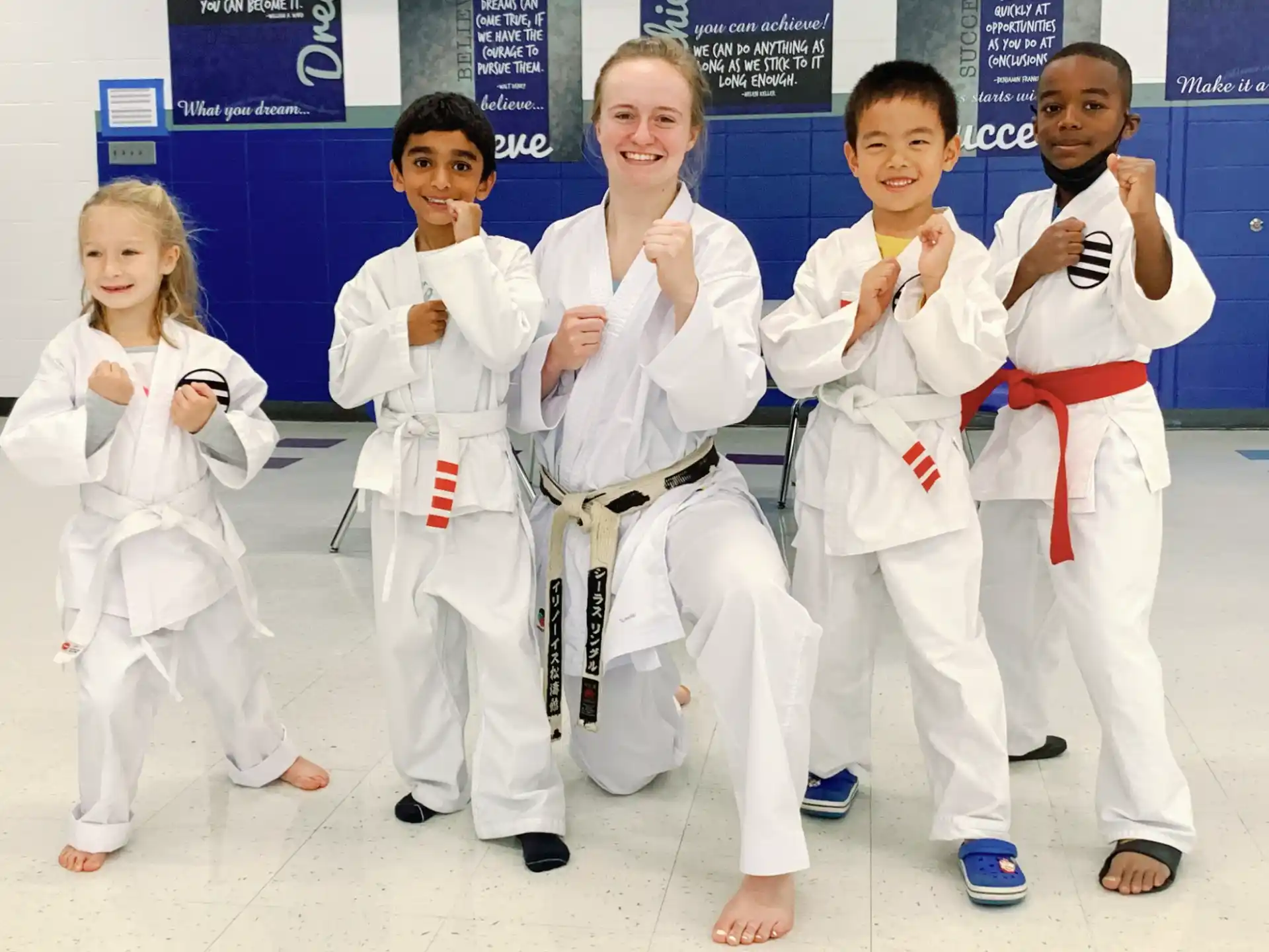 a group of people in karate uniforms