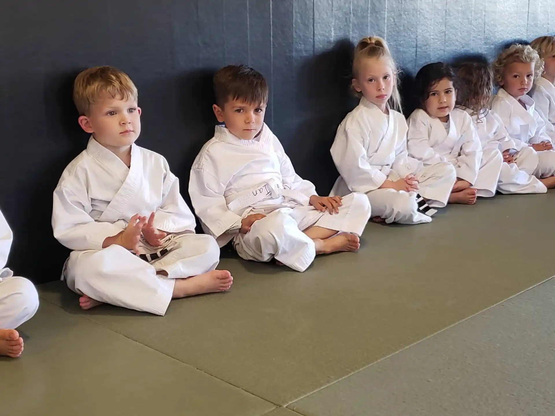 a group of children sitting on the floor