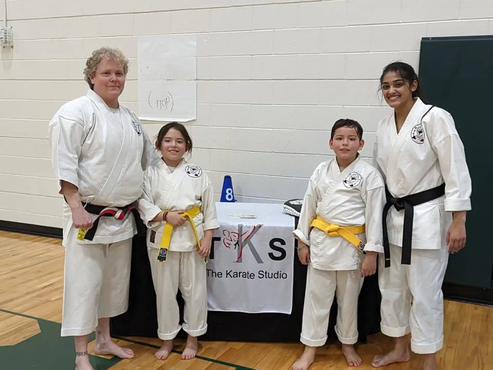a group of women in karate uniforms