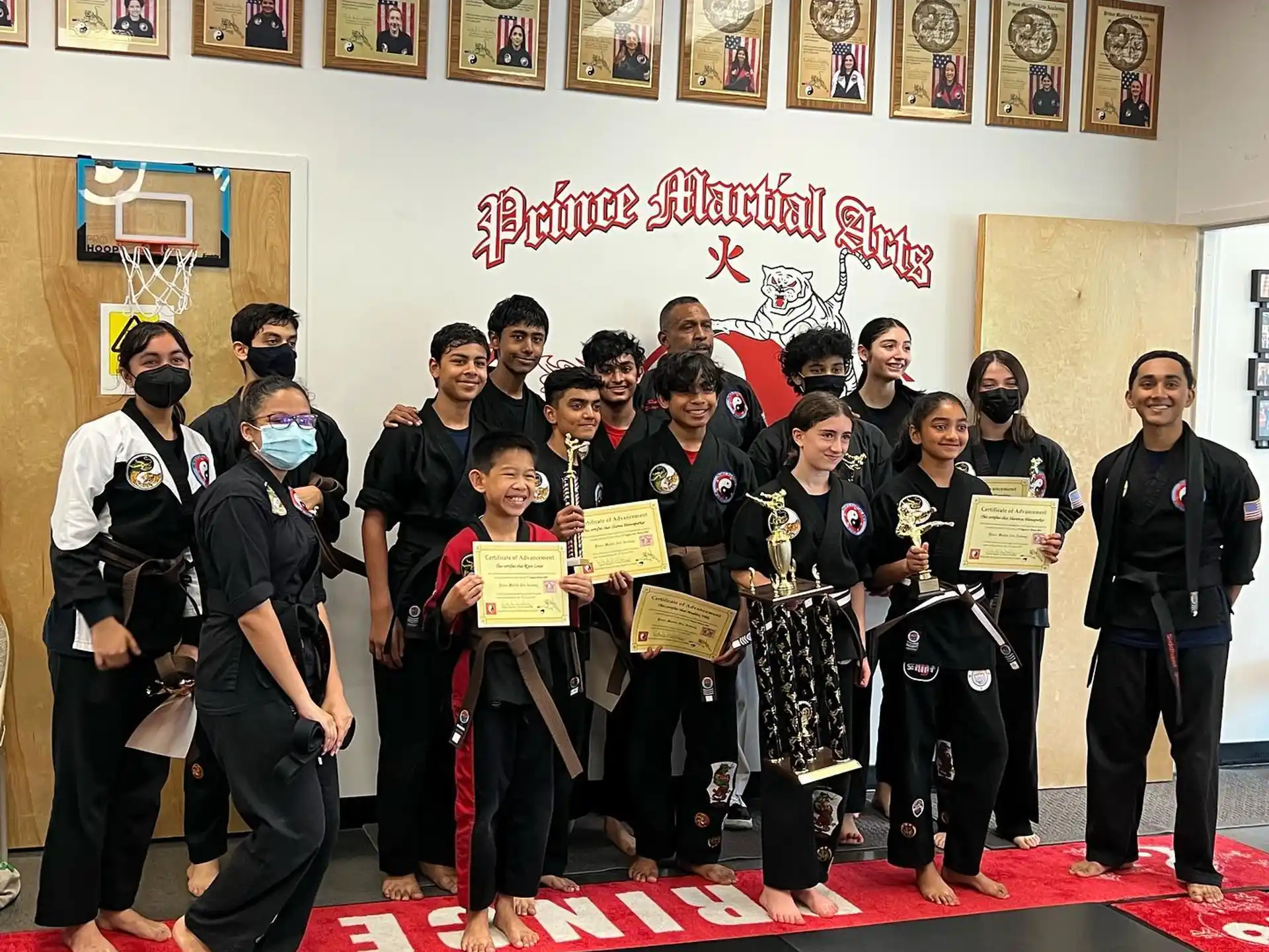 a group of people holding certificates