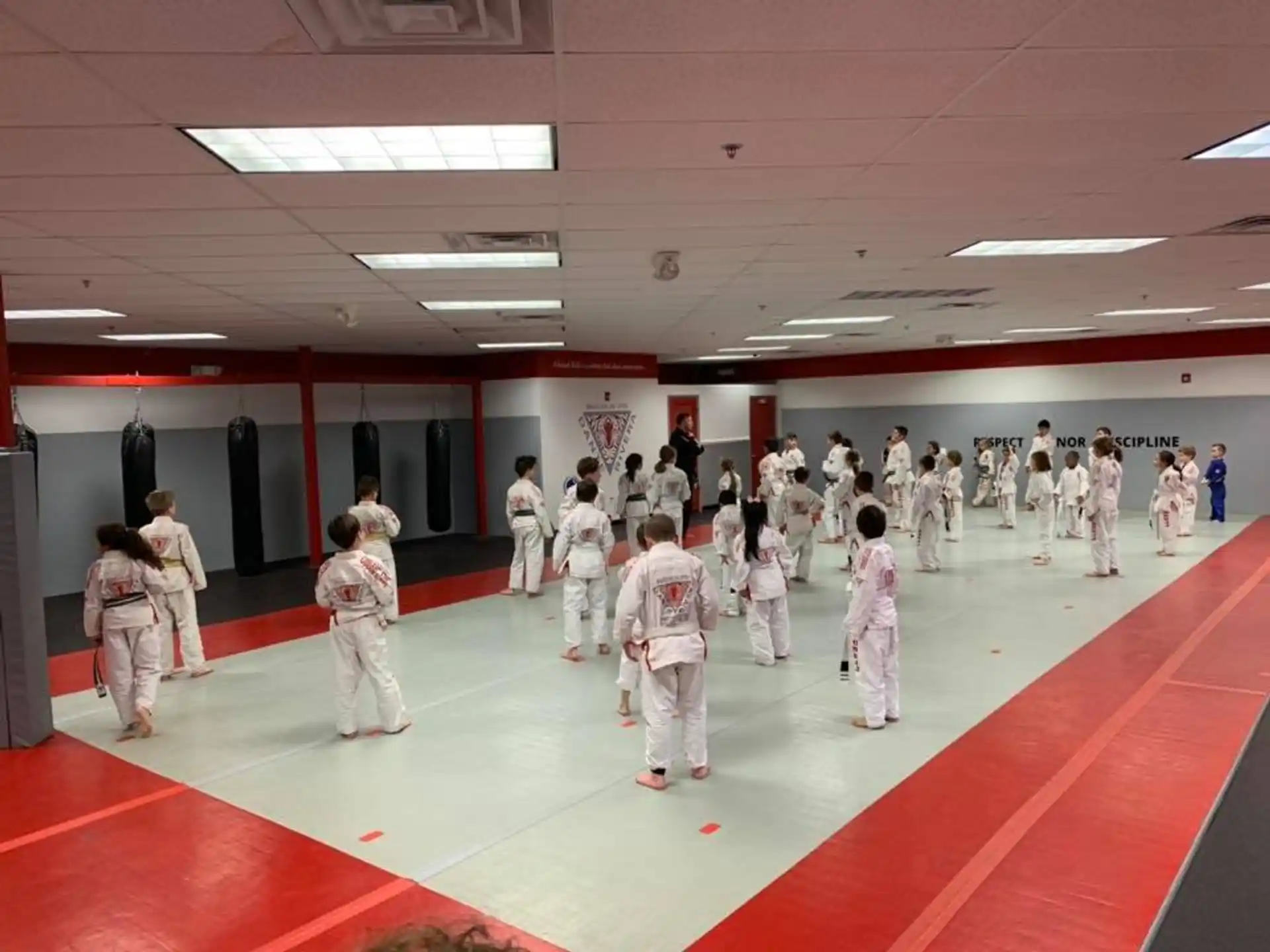 a group of people in white uniforms in a room