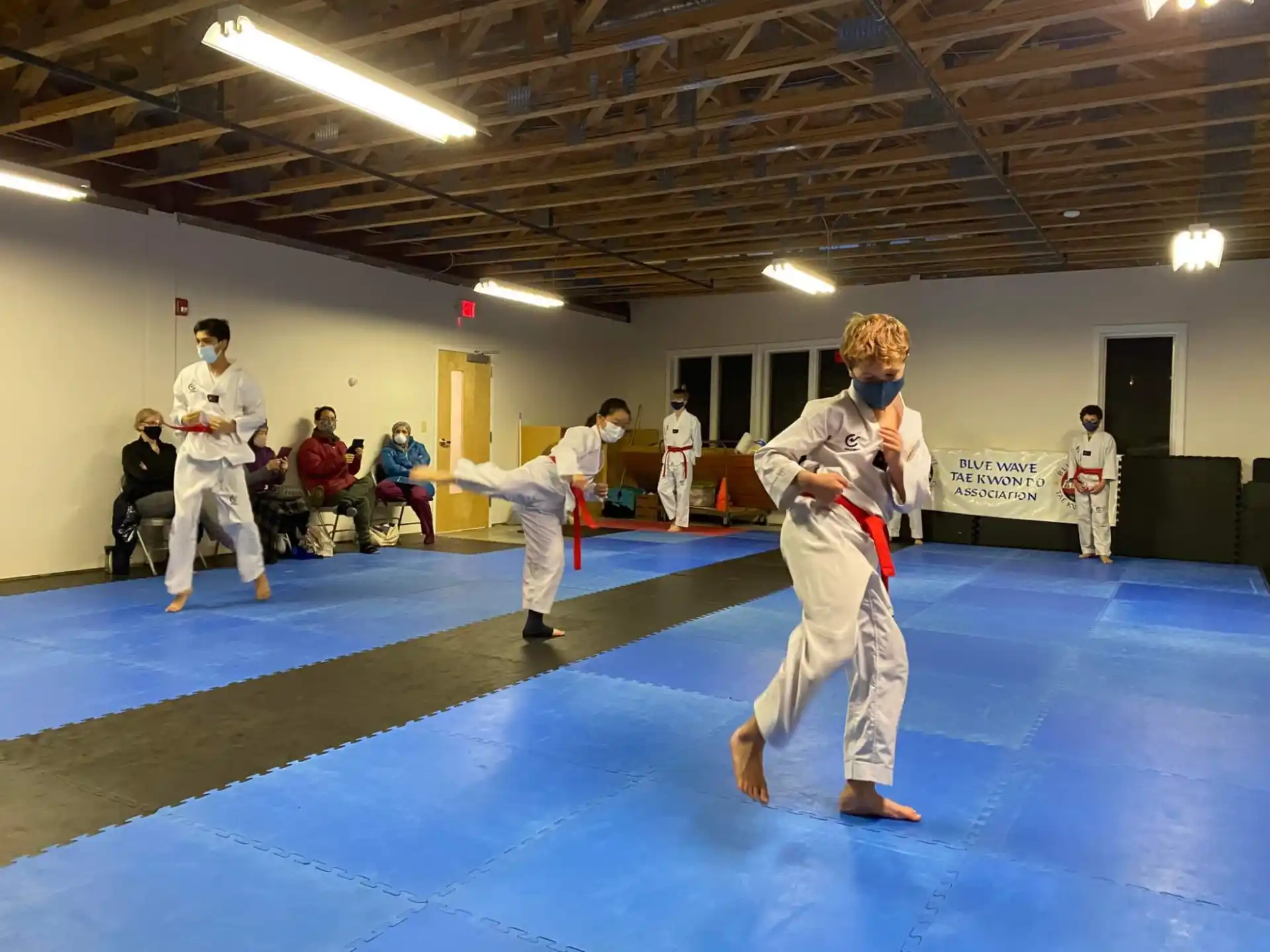 a group of people in karate uniforms