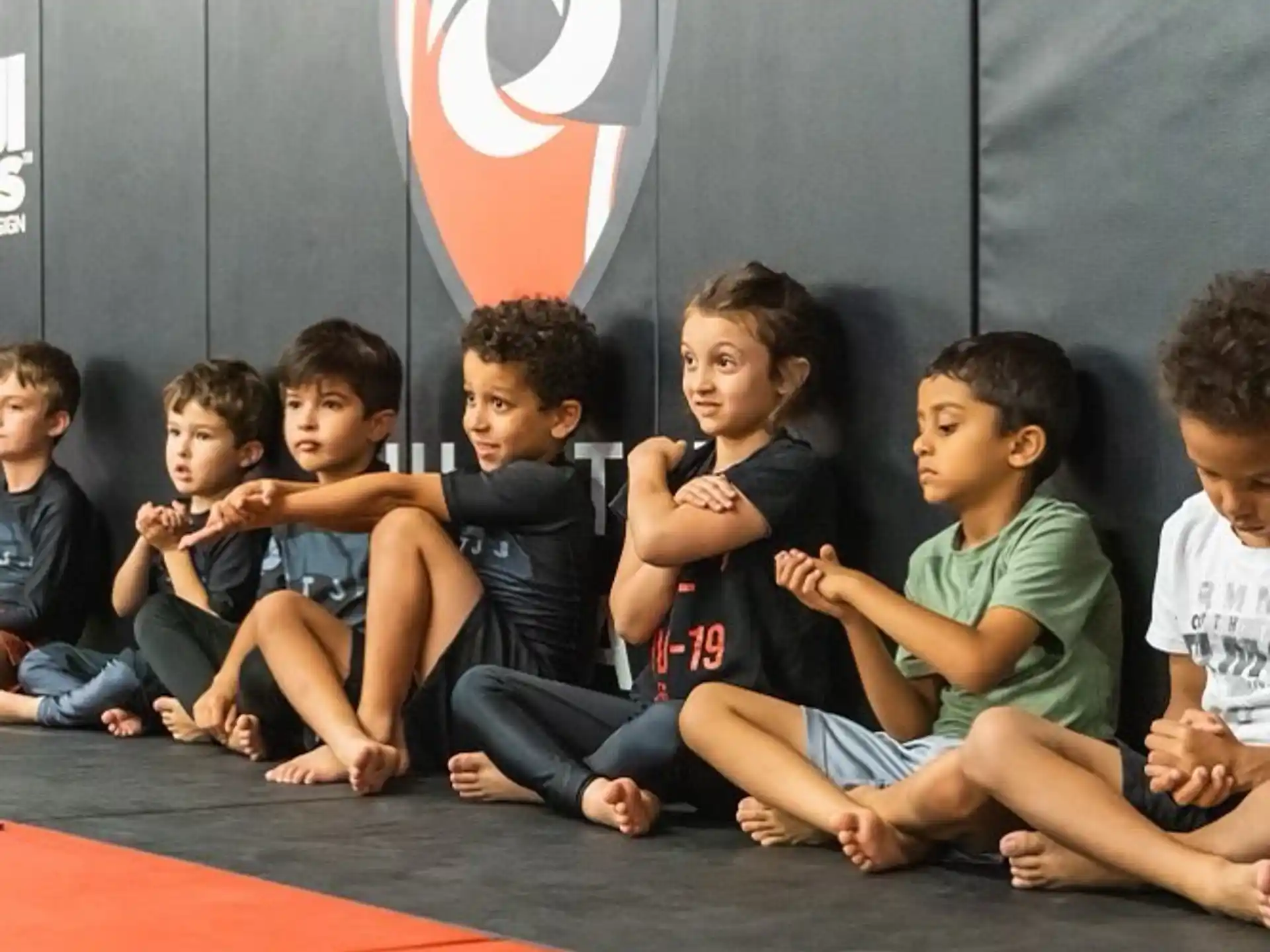 a group of children sitting on the floor