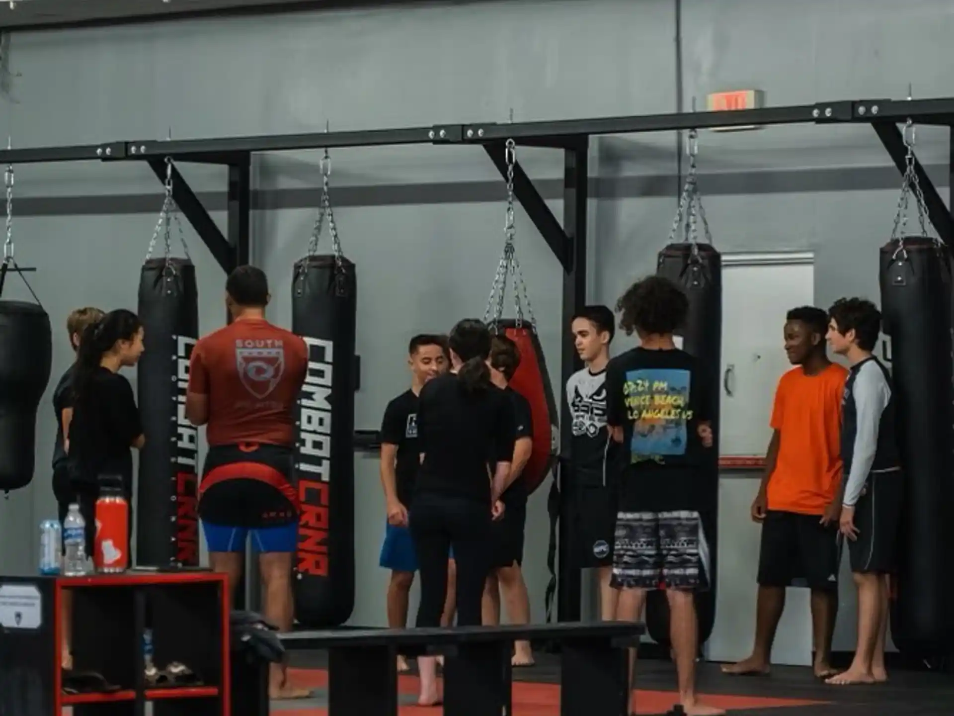 a group of people standing in a gym
