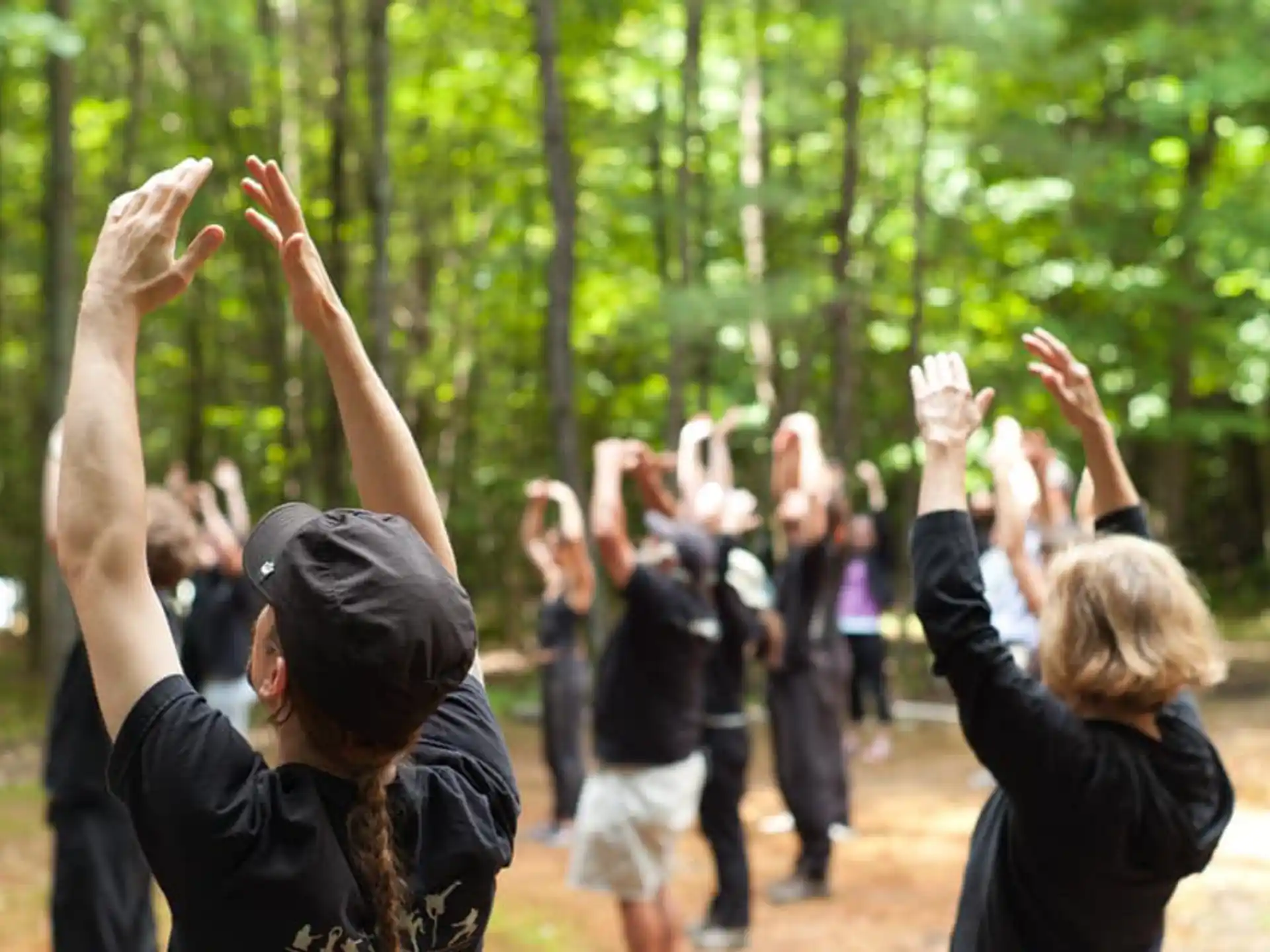 a group of people raising their hands