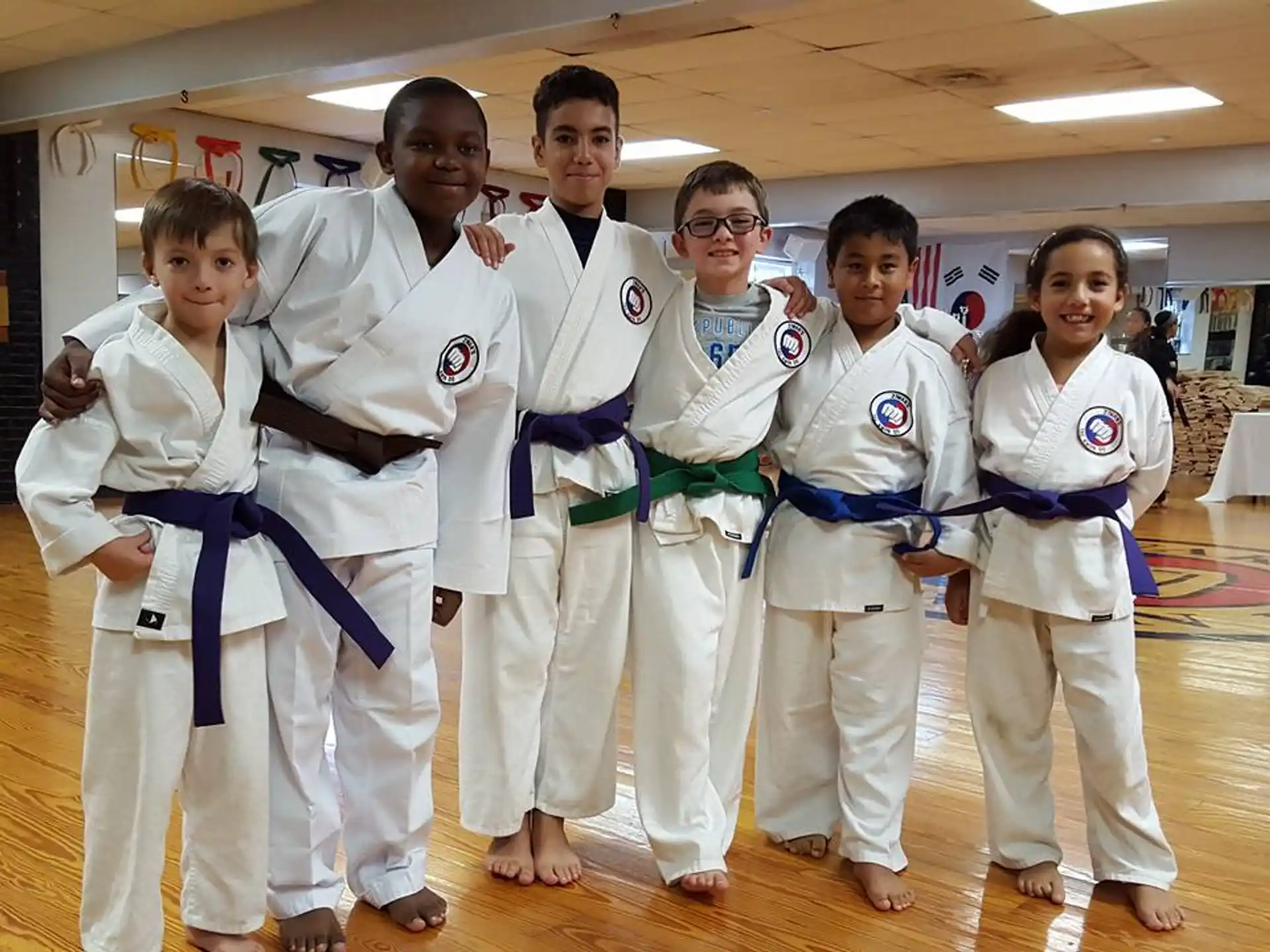 a group of people in karate uniforms