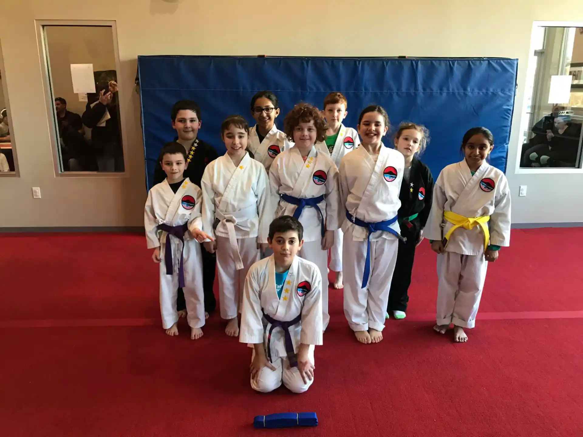 a group of people in karate uniforms