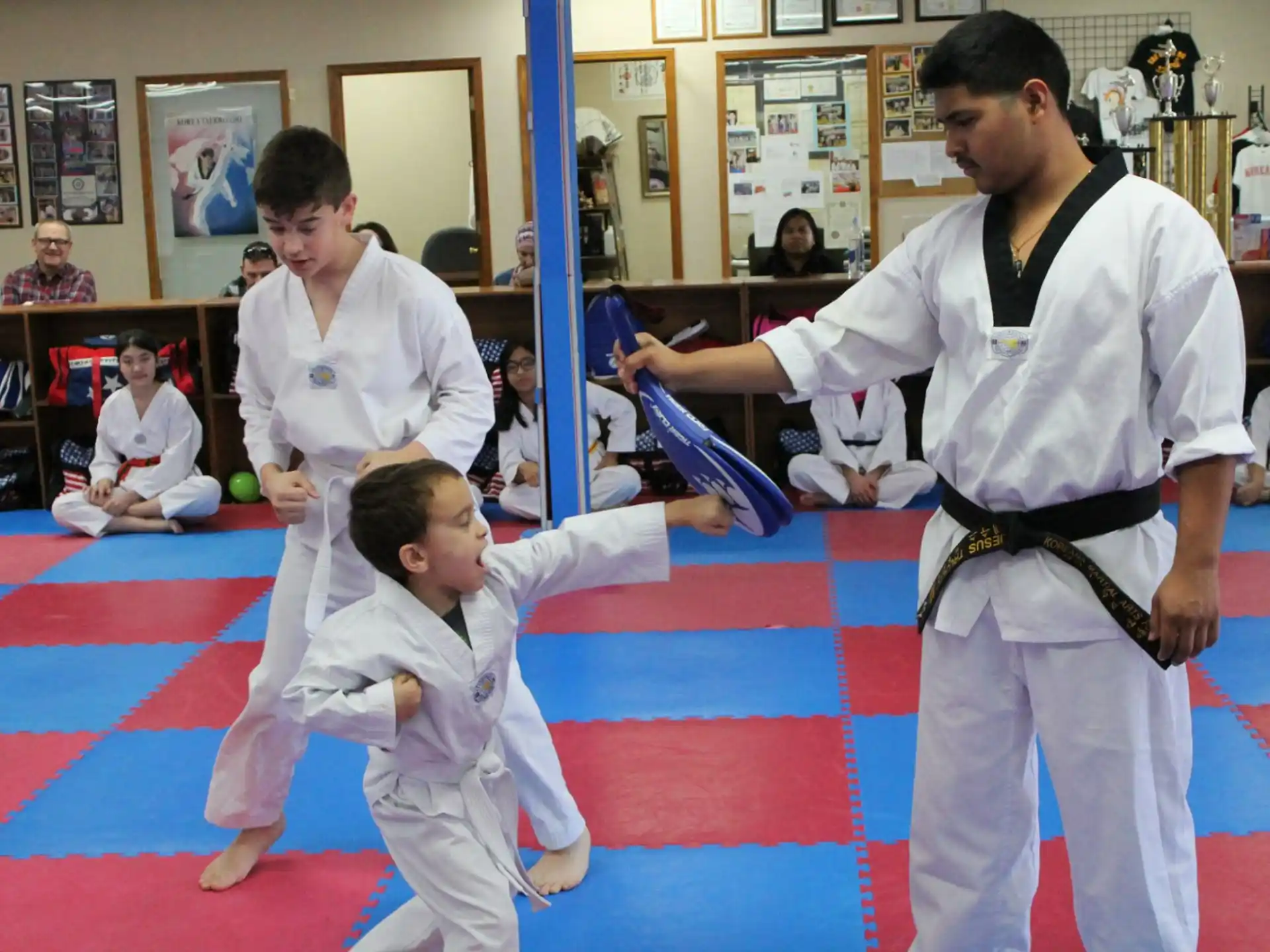 a group of people in karate uniforms