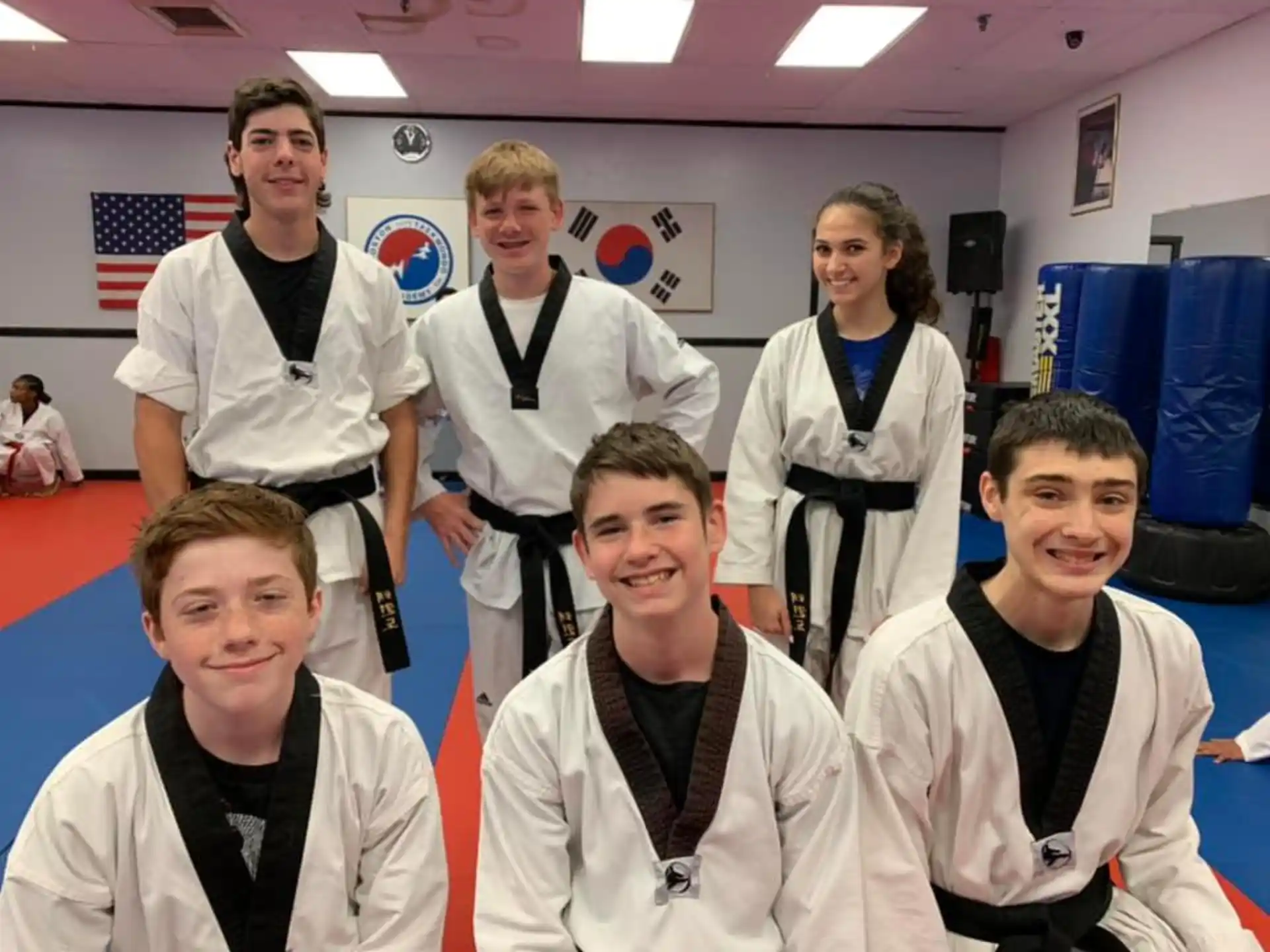 a group of people wearing white shirts