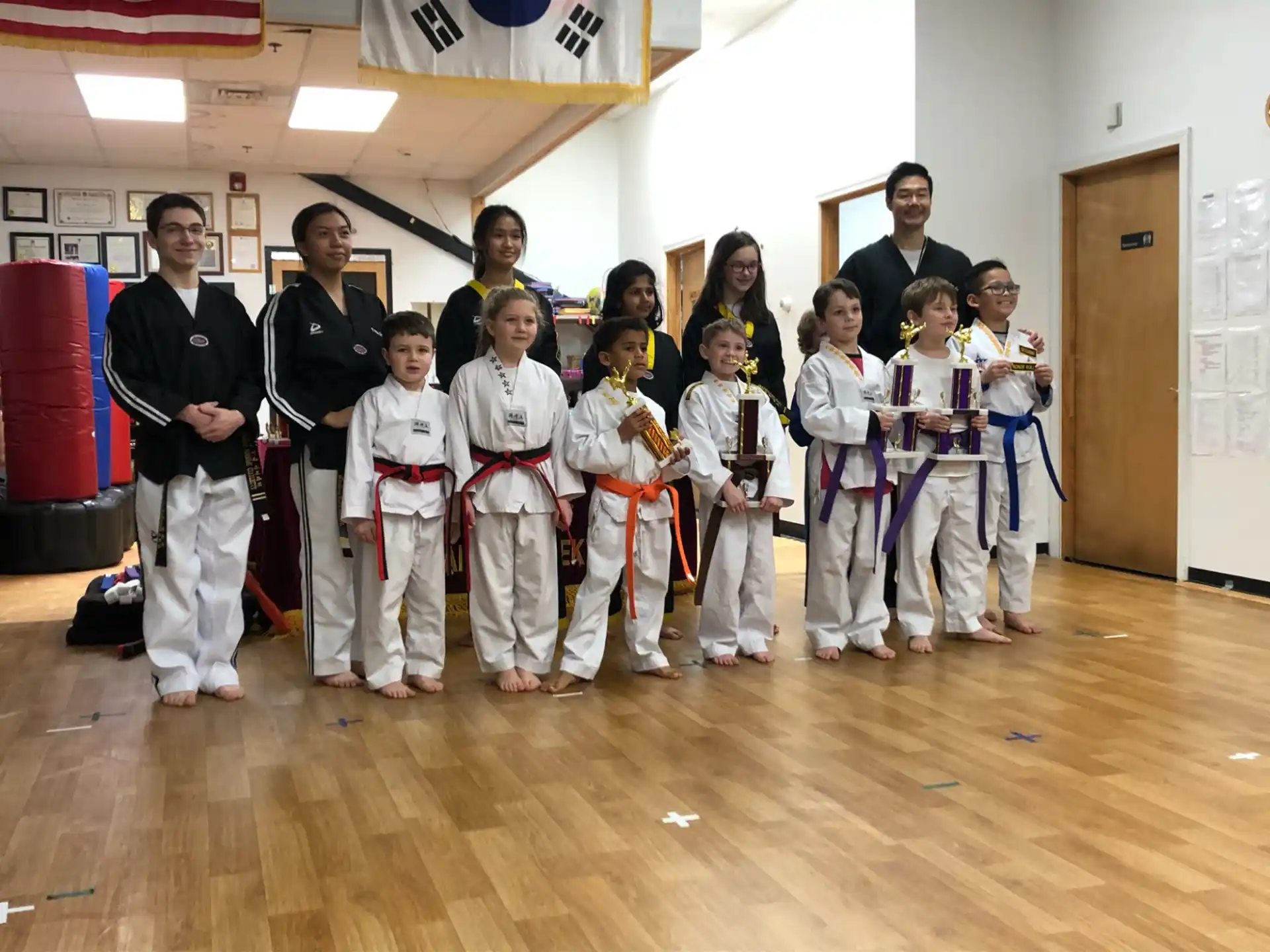 a group of people in karate uniforms