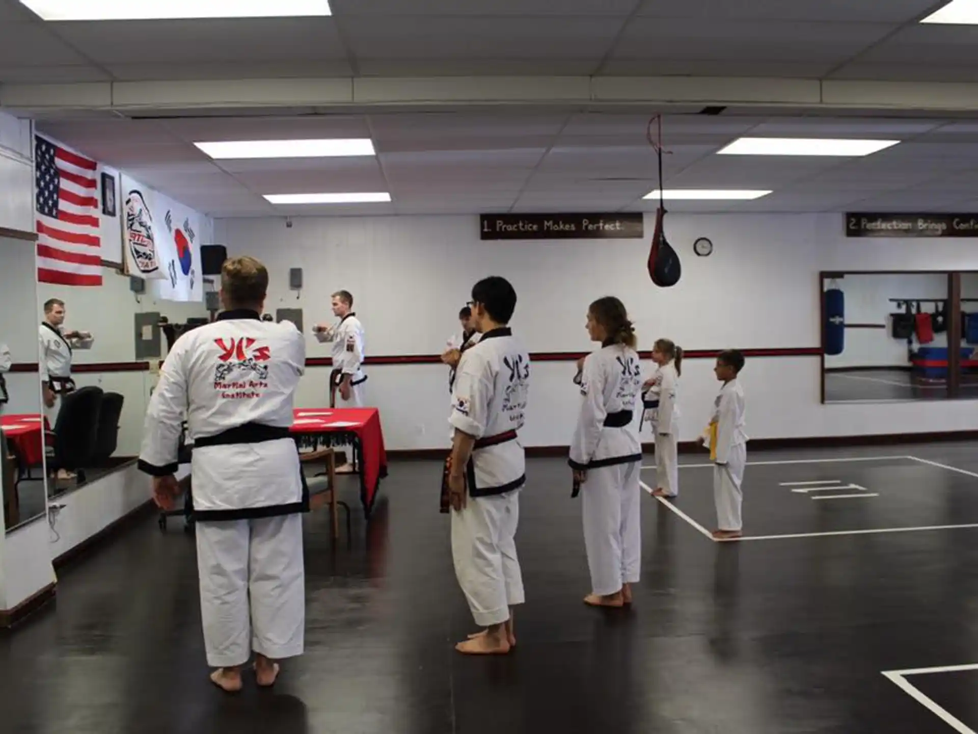 a group of people in karate uniforms