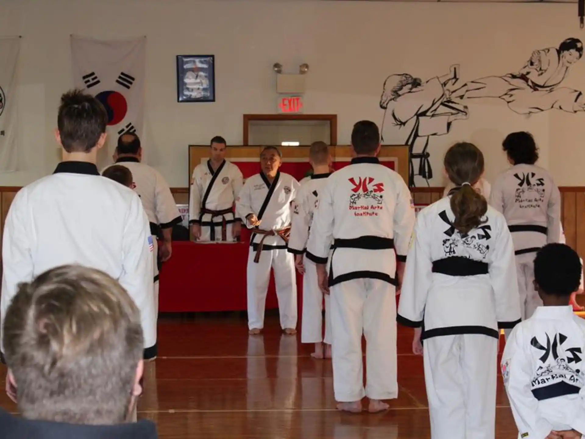 a group of people in karate uniforms