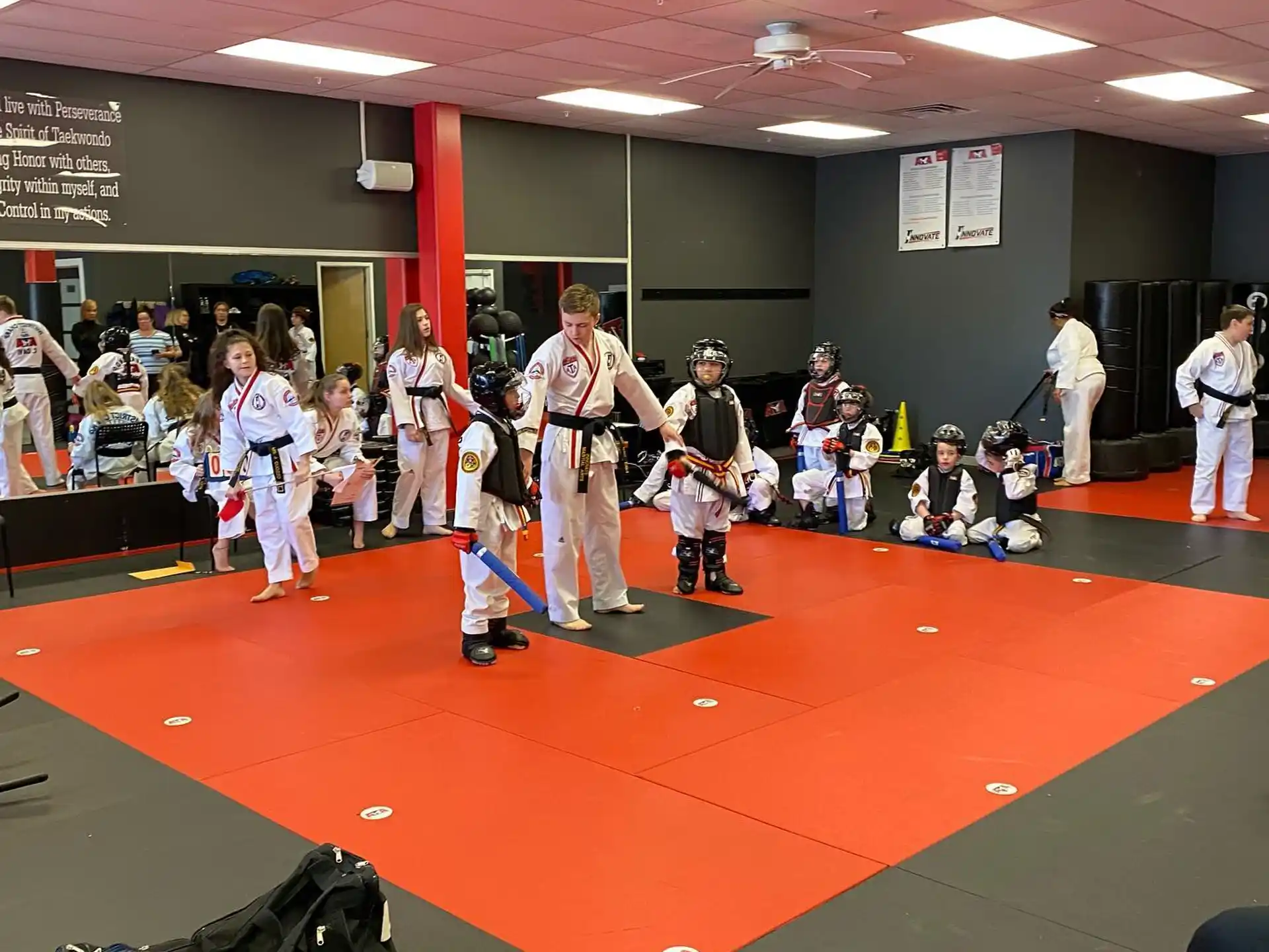 a group of people in karate uniforms