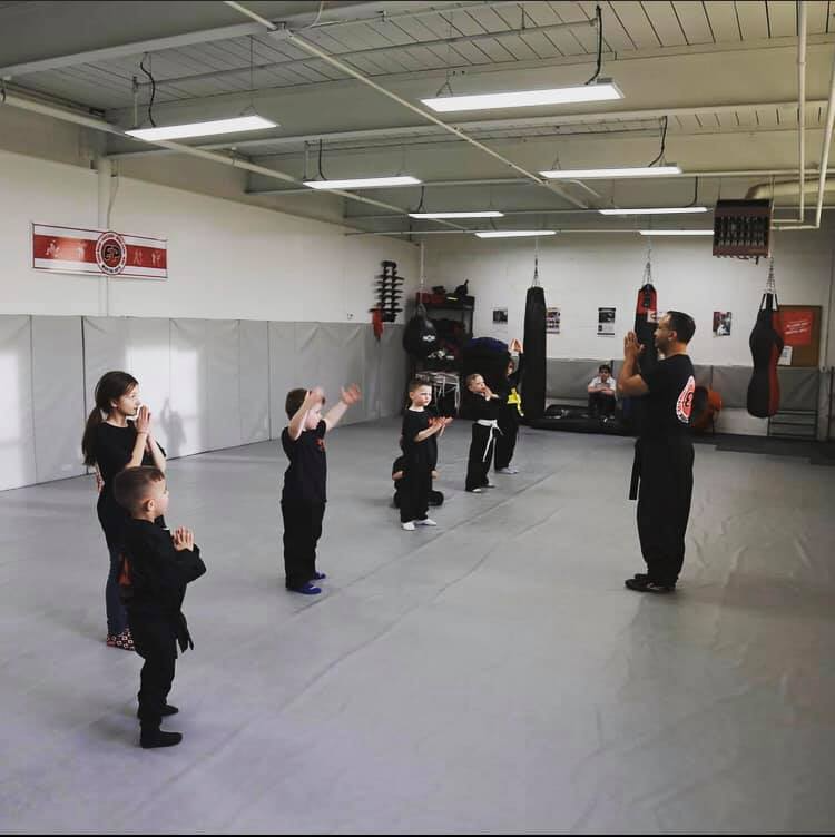 a group of people exercising in a gym