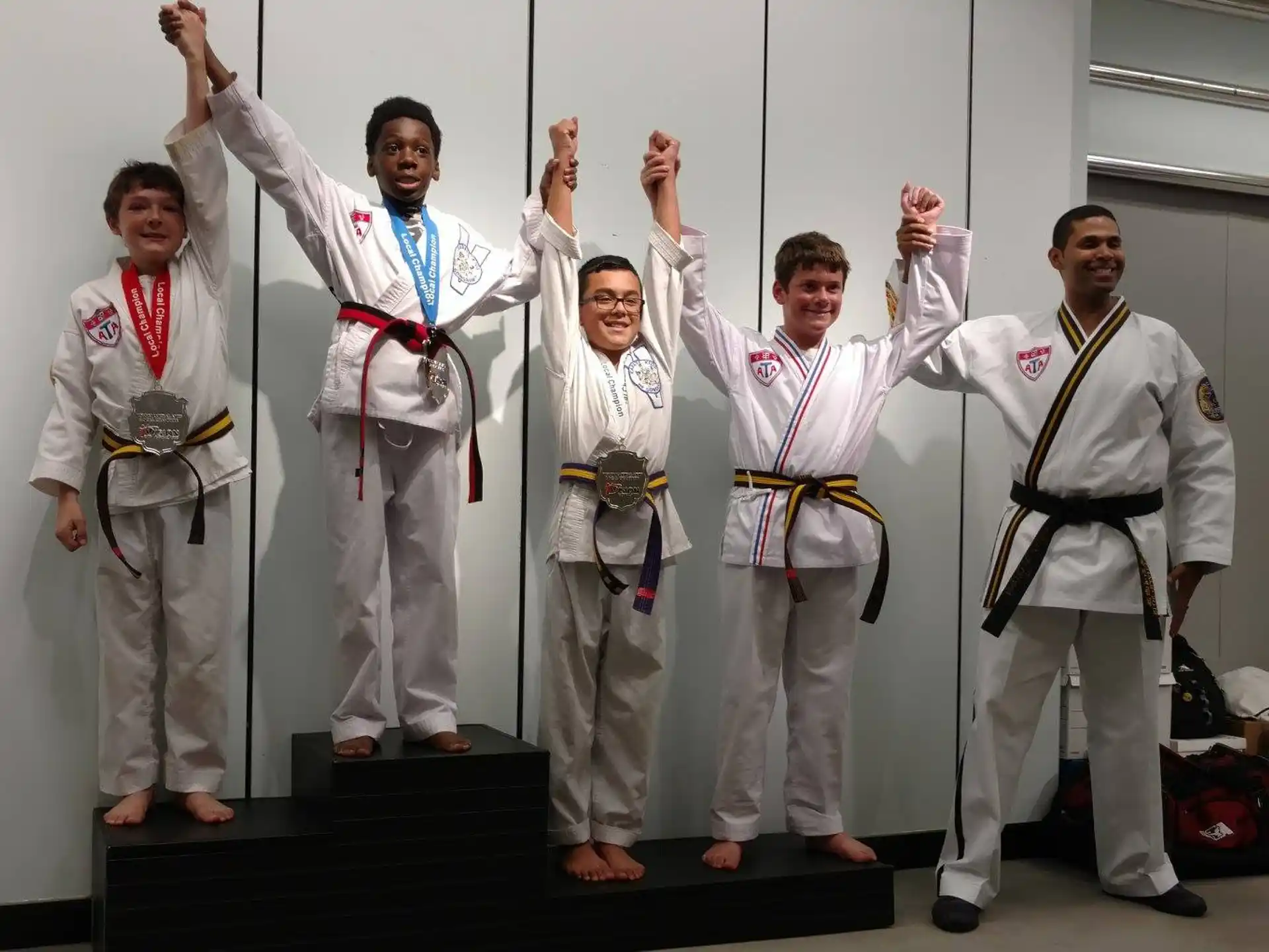 a group of men in karate uniforms