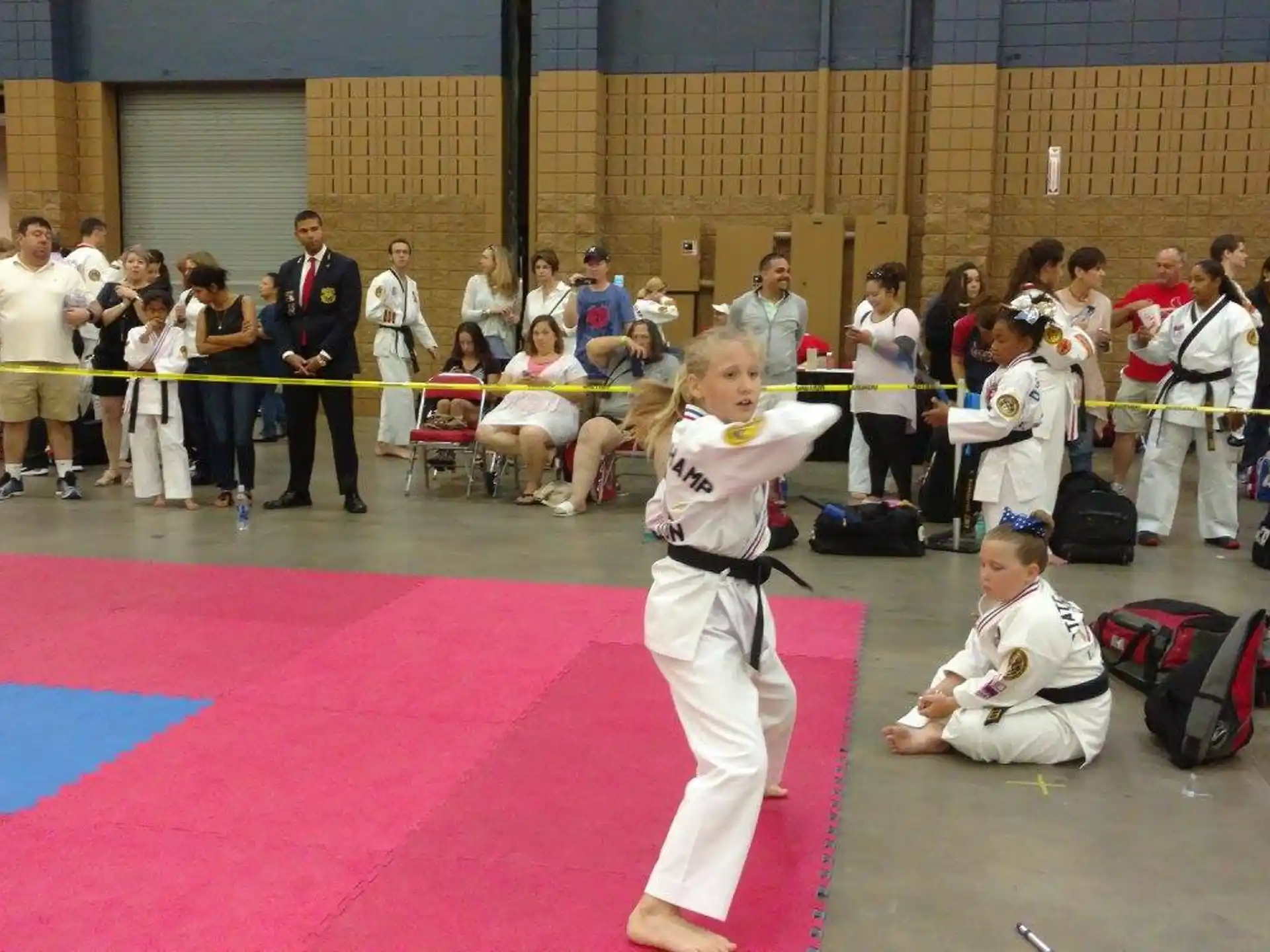 a group of people in a karate class