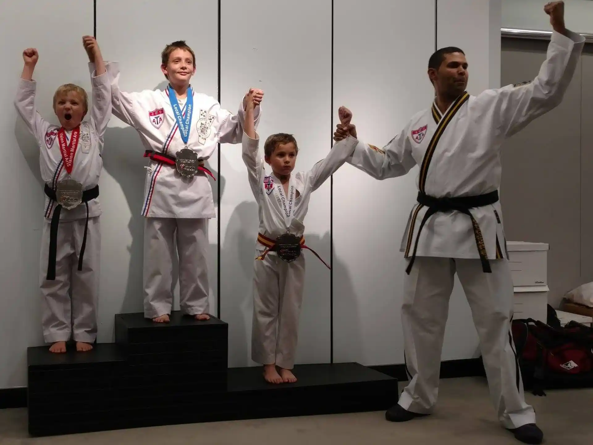 a group of people in karate uniforms