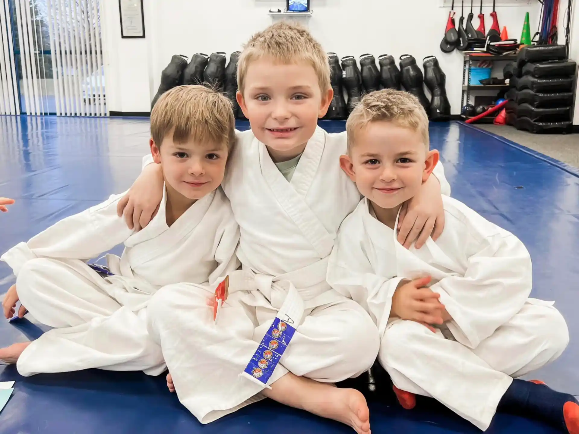 a group of boys in karate uniforms