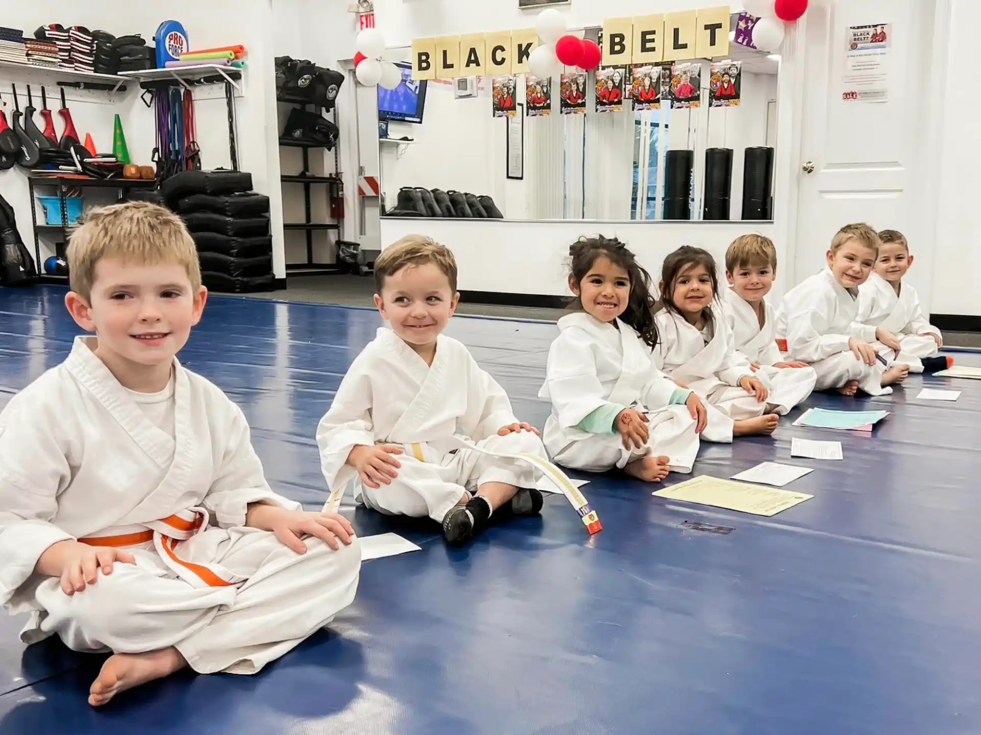 a group of children sitting on the floor