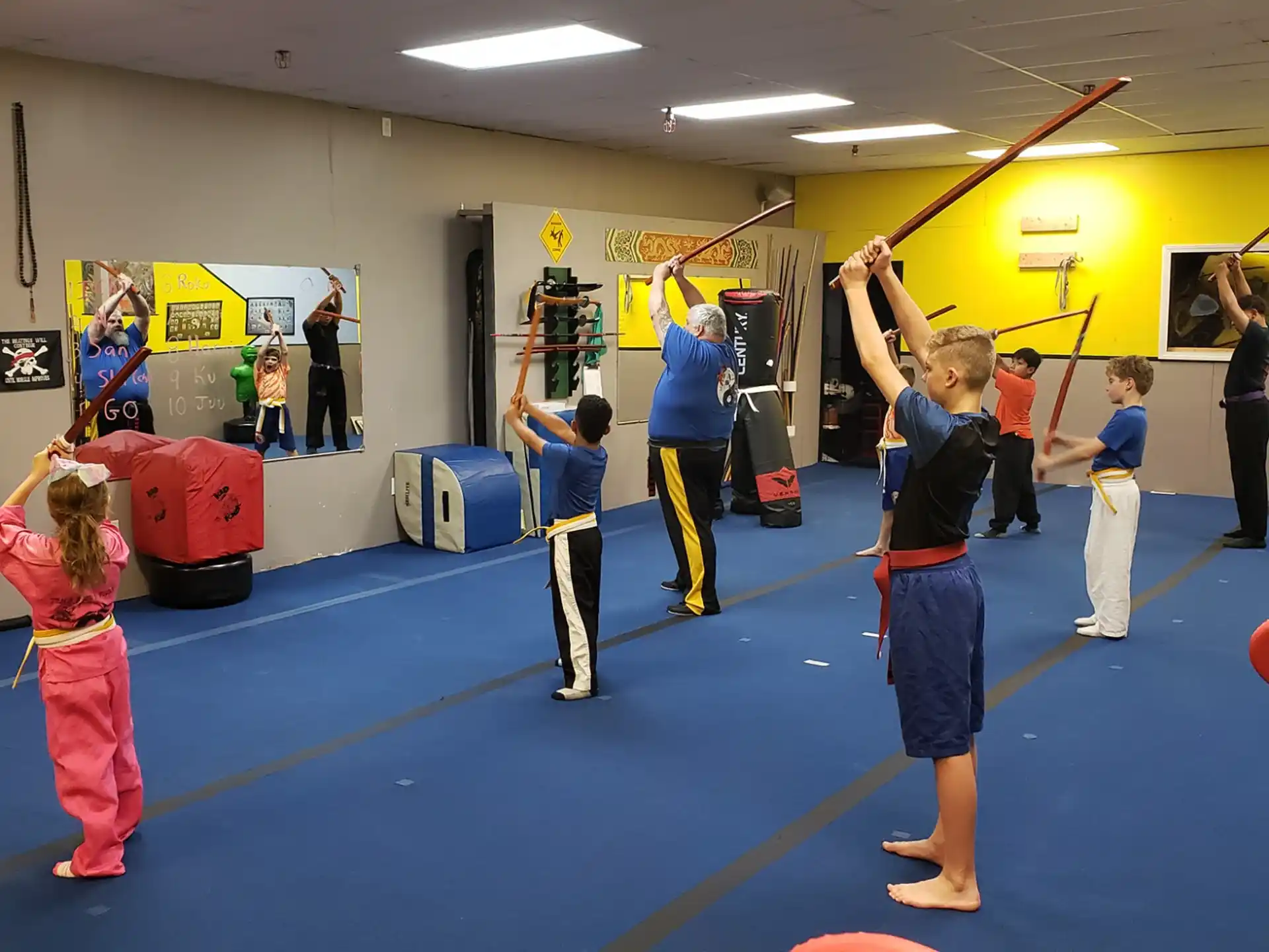 a group of children practicing in a gym