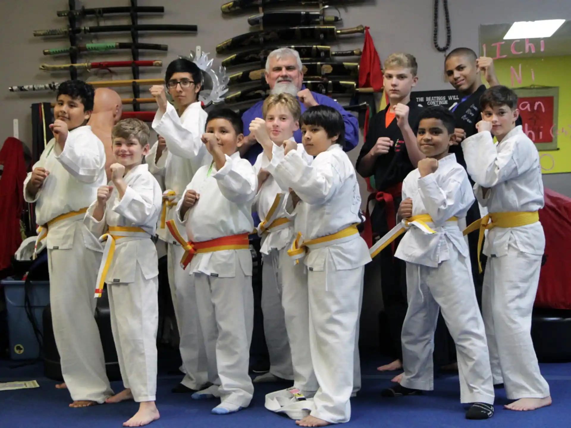 a group of people in karate uniforms