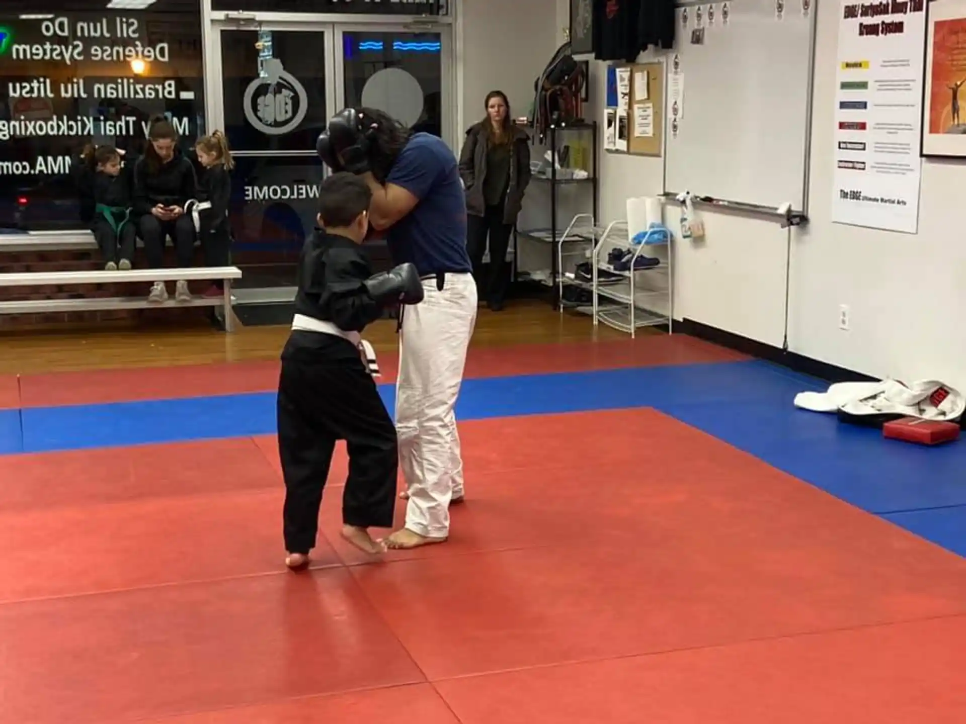 a man and a woman in a karate uniform