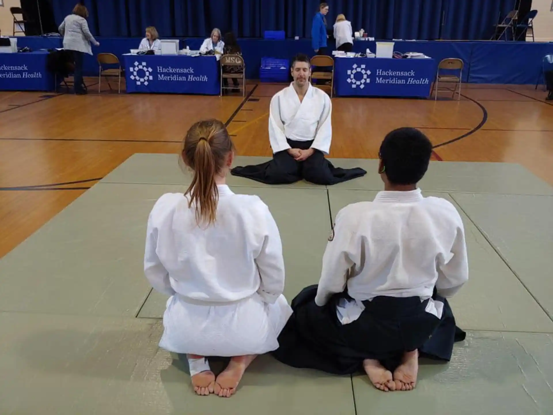 a group of people sitting on the floor