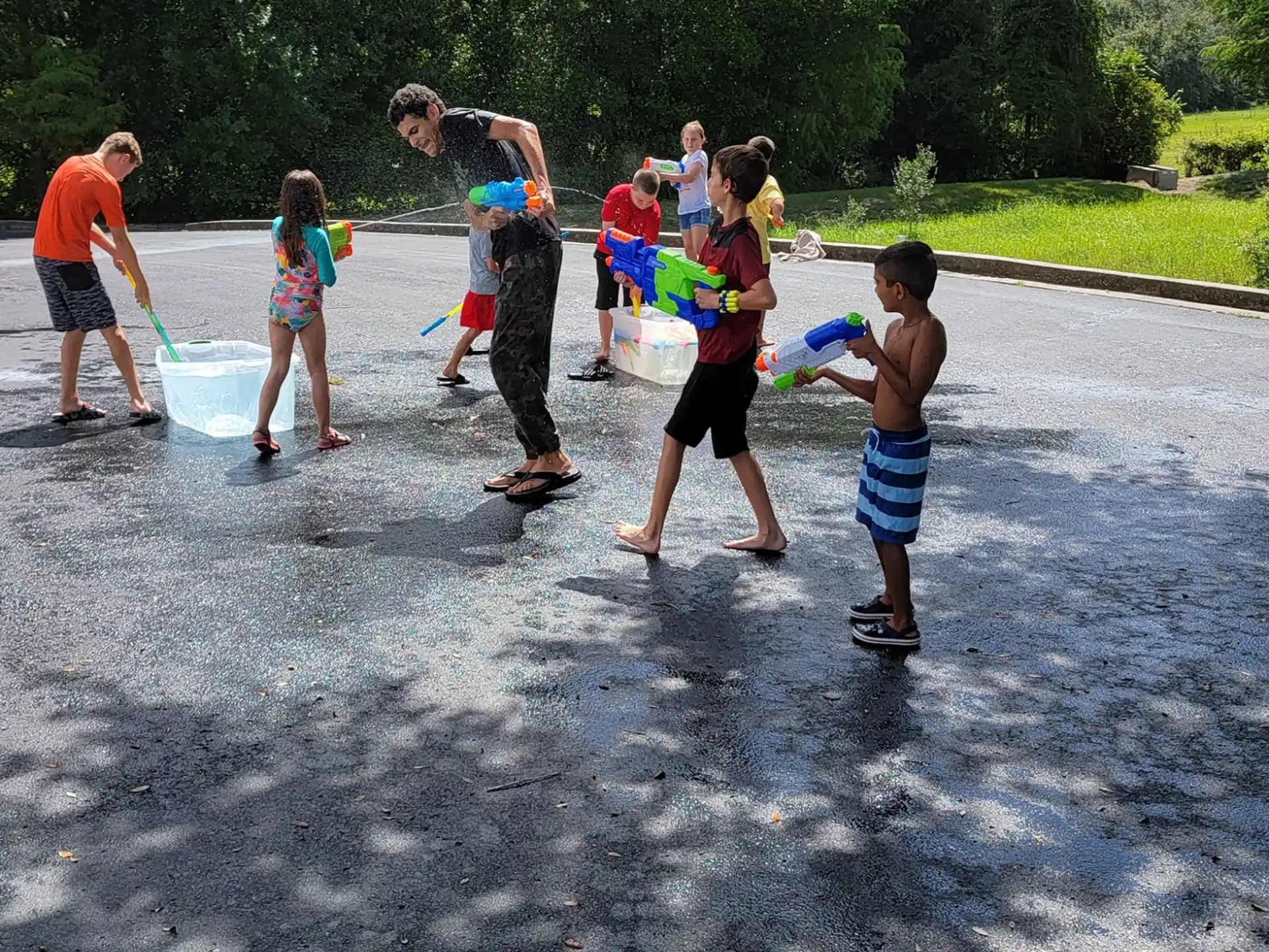 a group of people playing in the mud