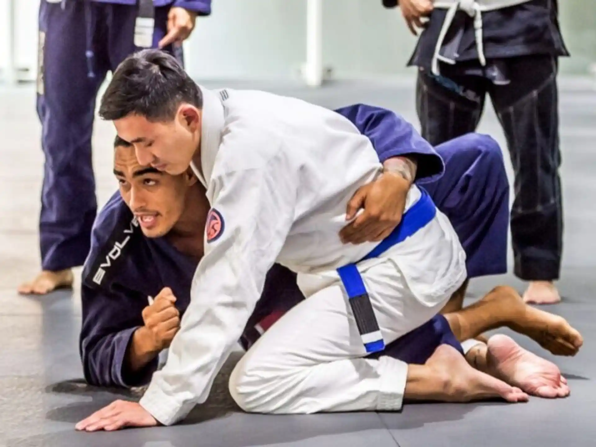 a couple of men in karate uniforms