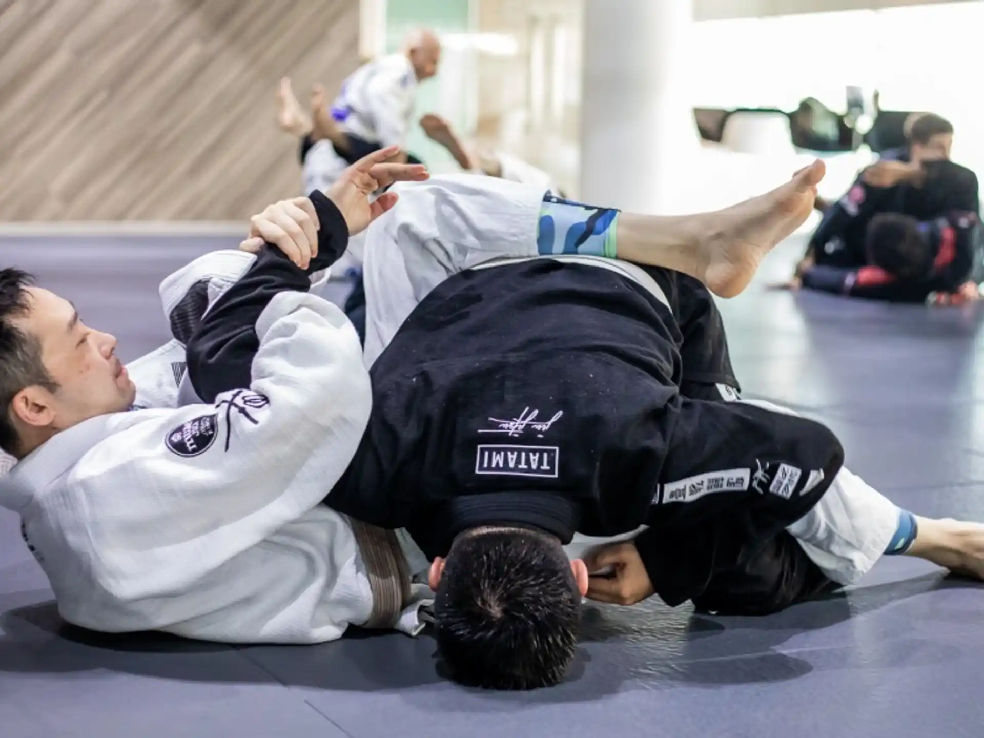 a man lying on another man