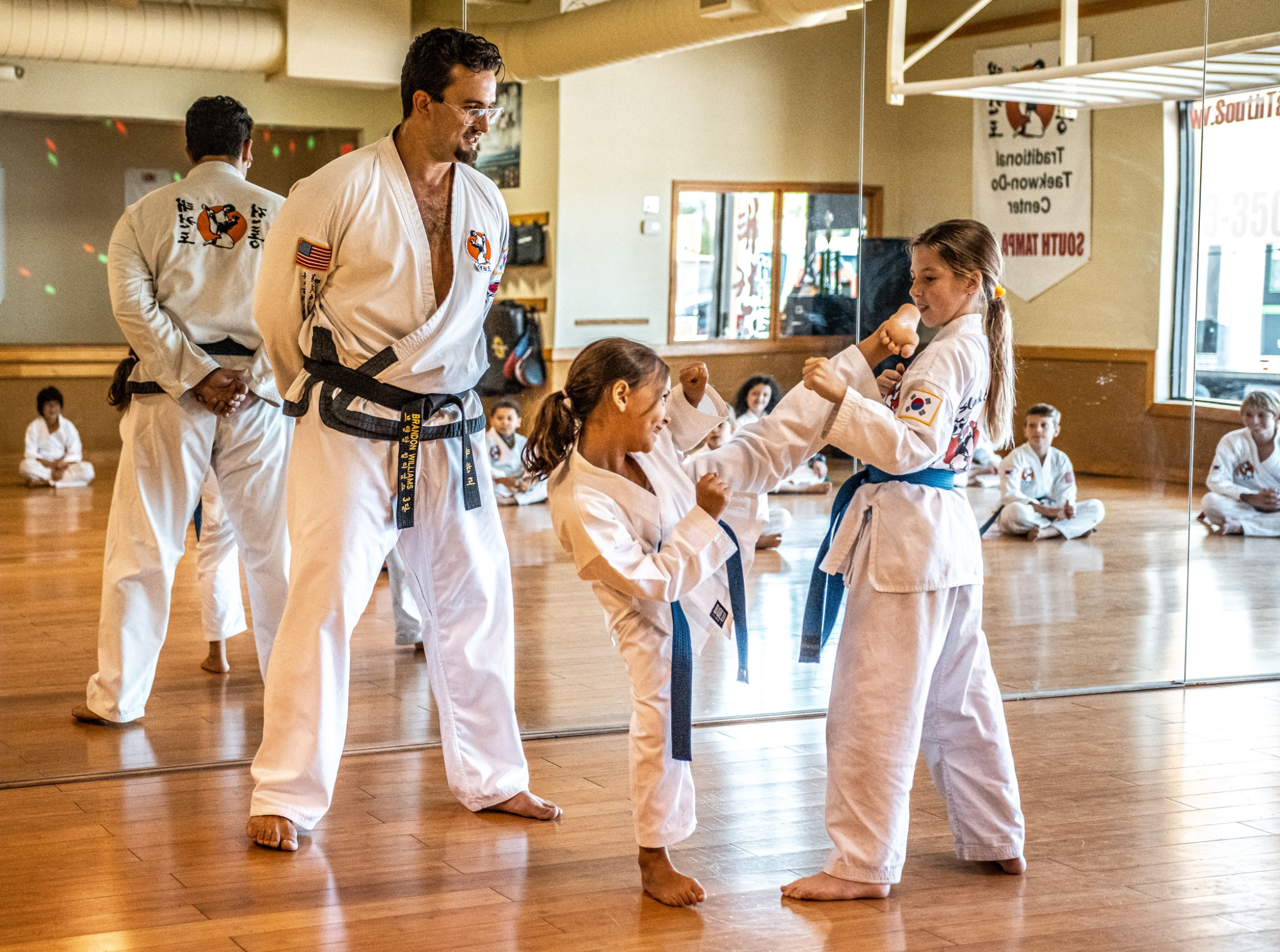 a group of people in karate uniforms