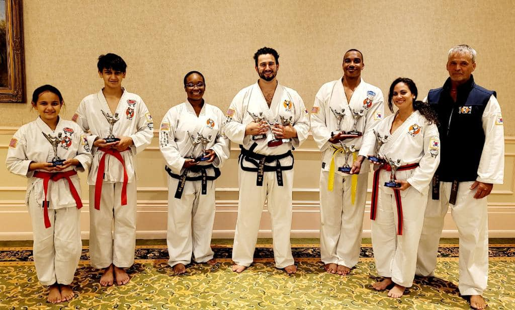 a group of people in karate uniforms
