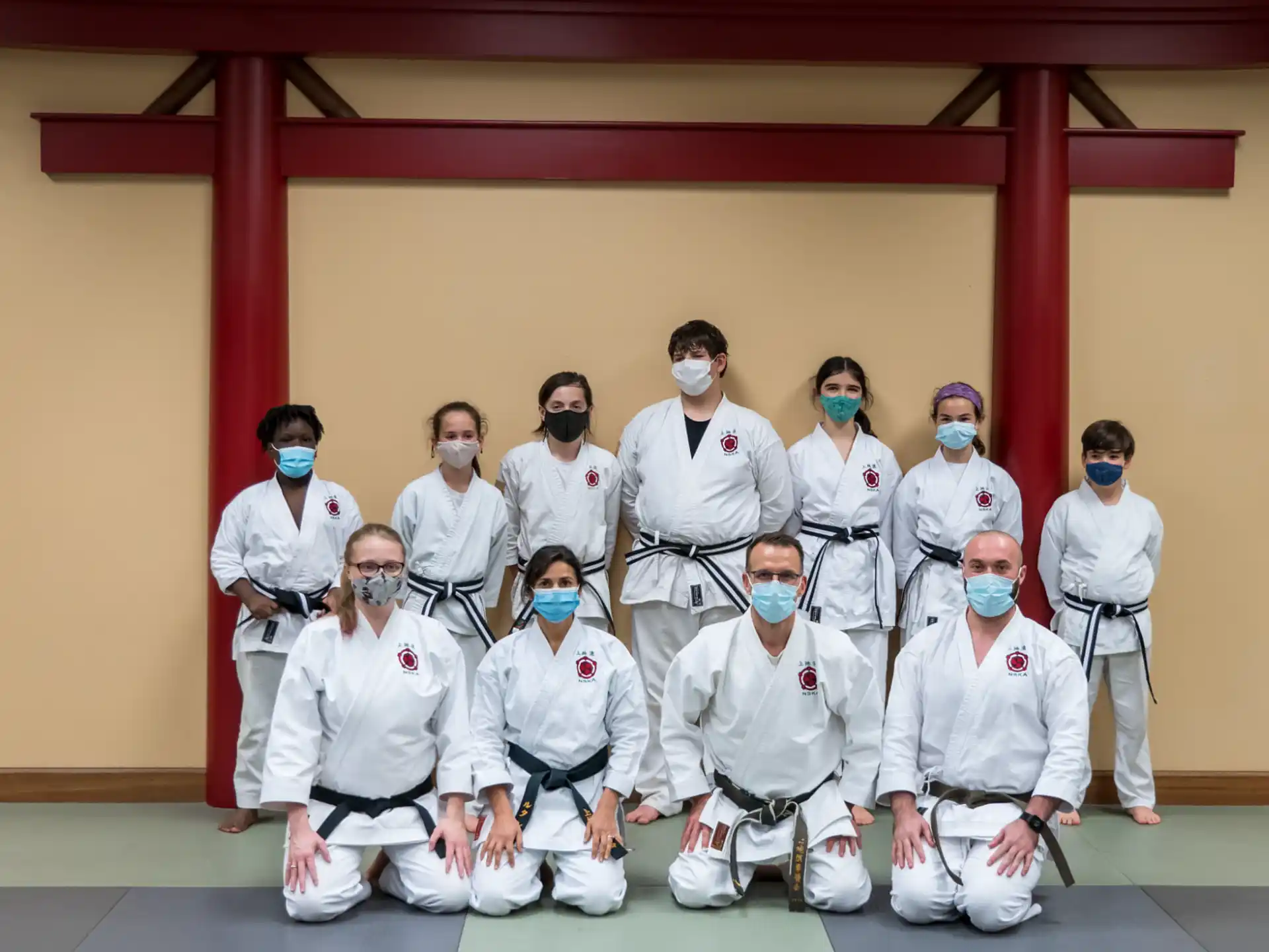a group of people wearing white uniforms