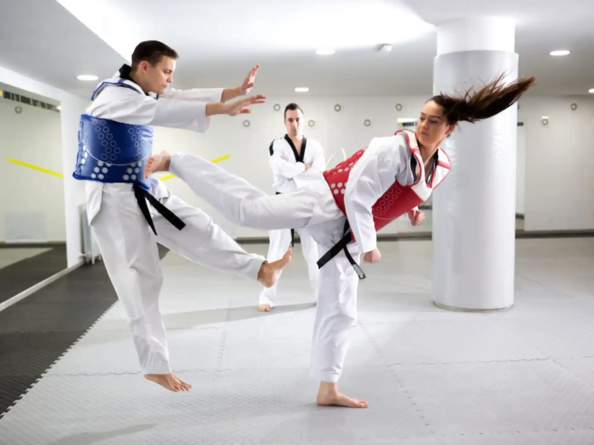 a group of people in karate uniforms