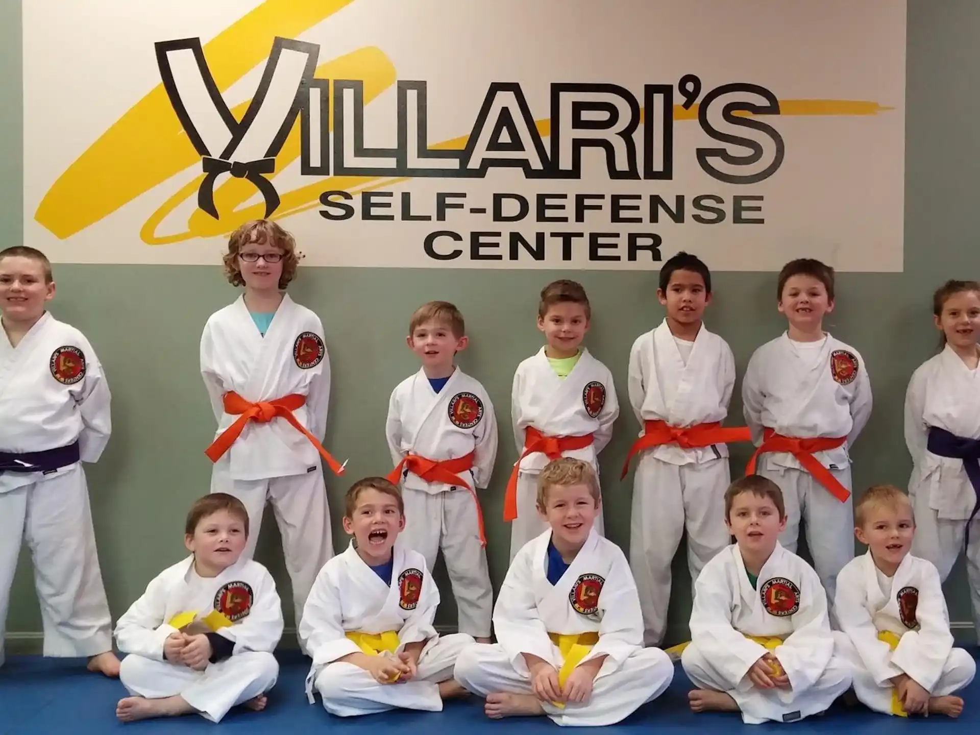 a group of people in karate uniforms