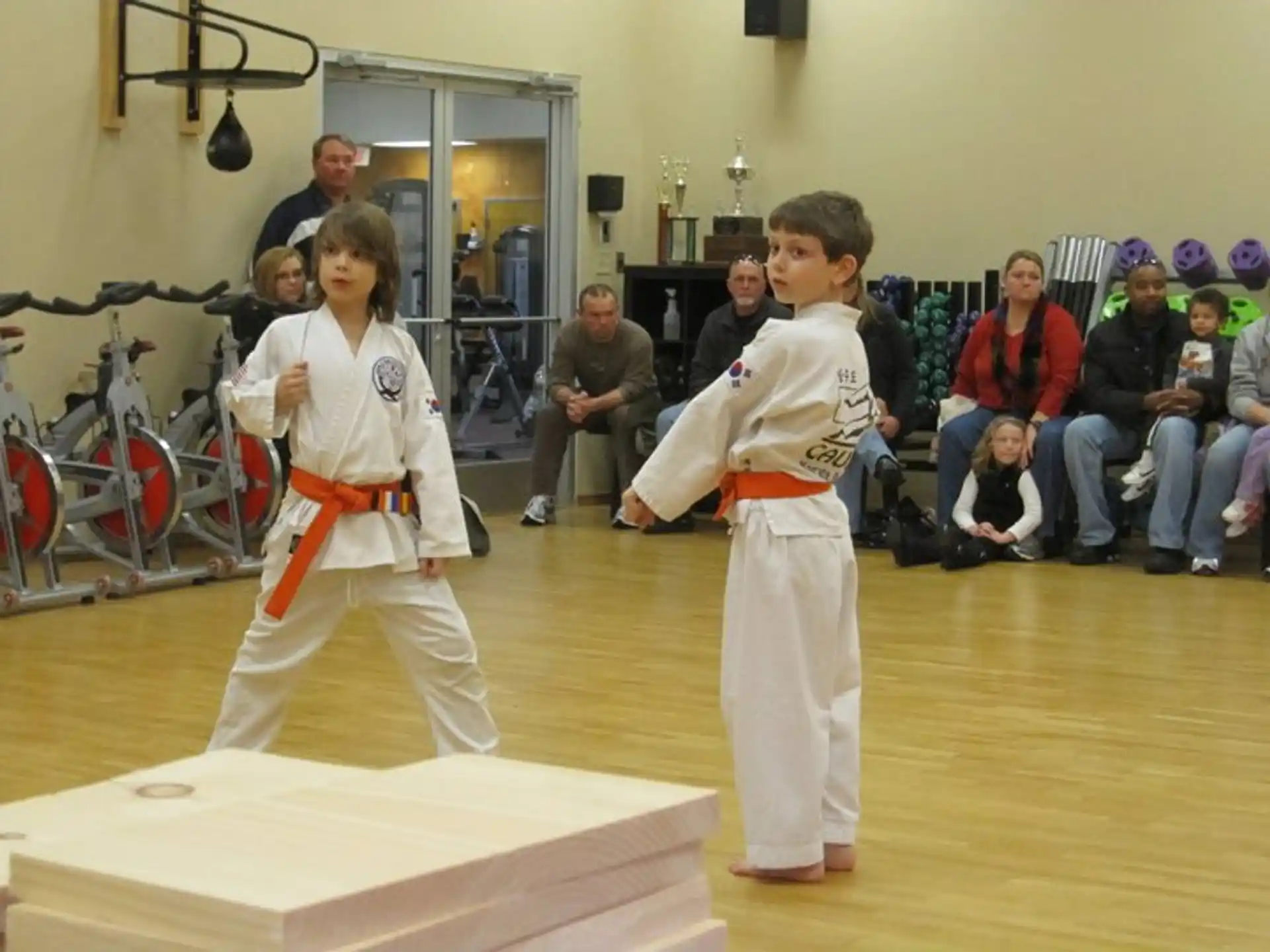 a couple of people in karate uniforms