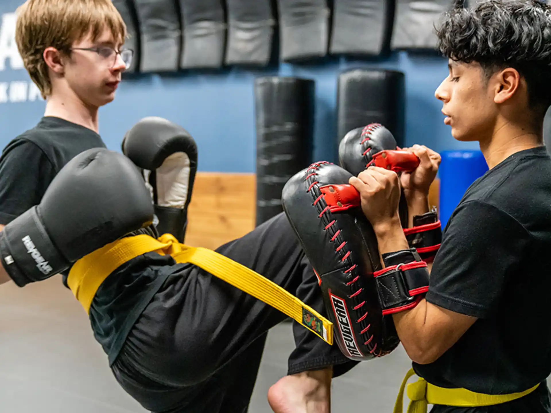 a couple of men boxing