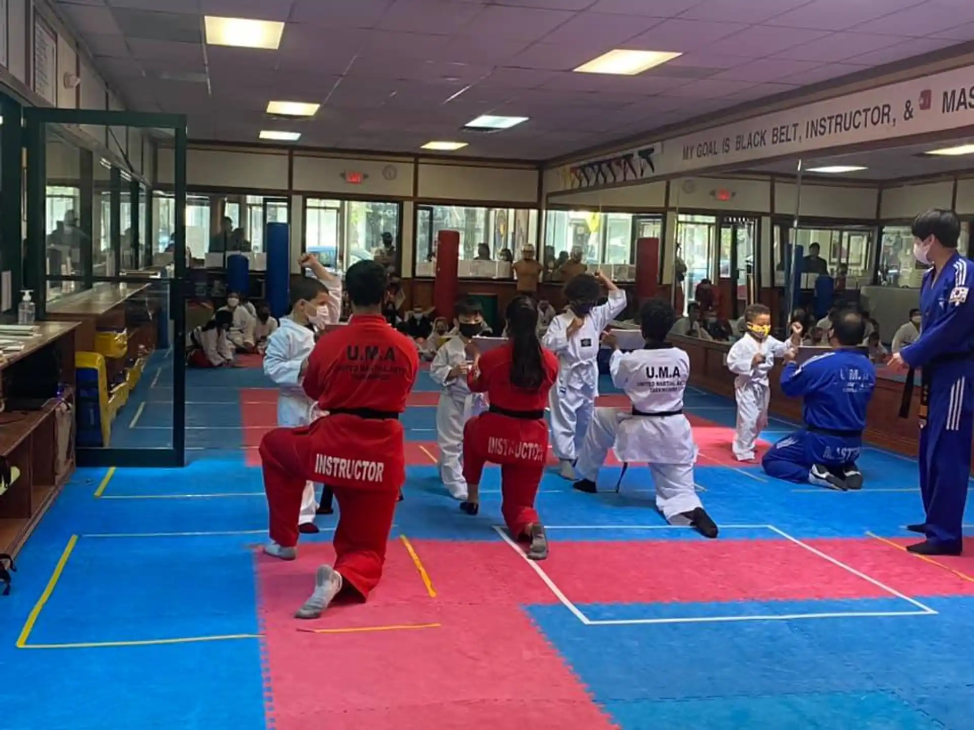 a group of kids in karate uniforms