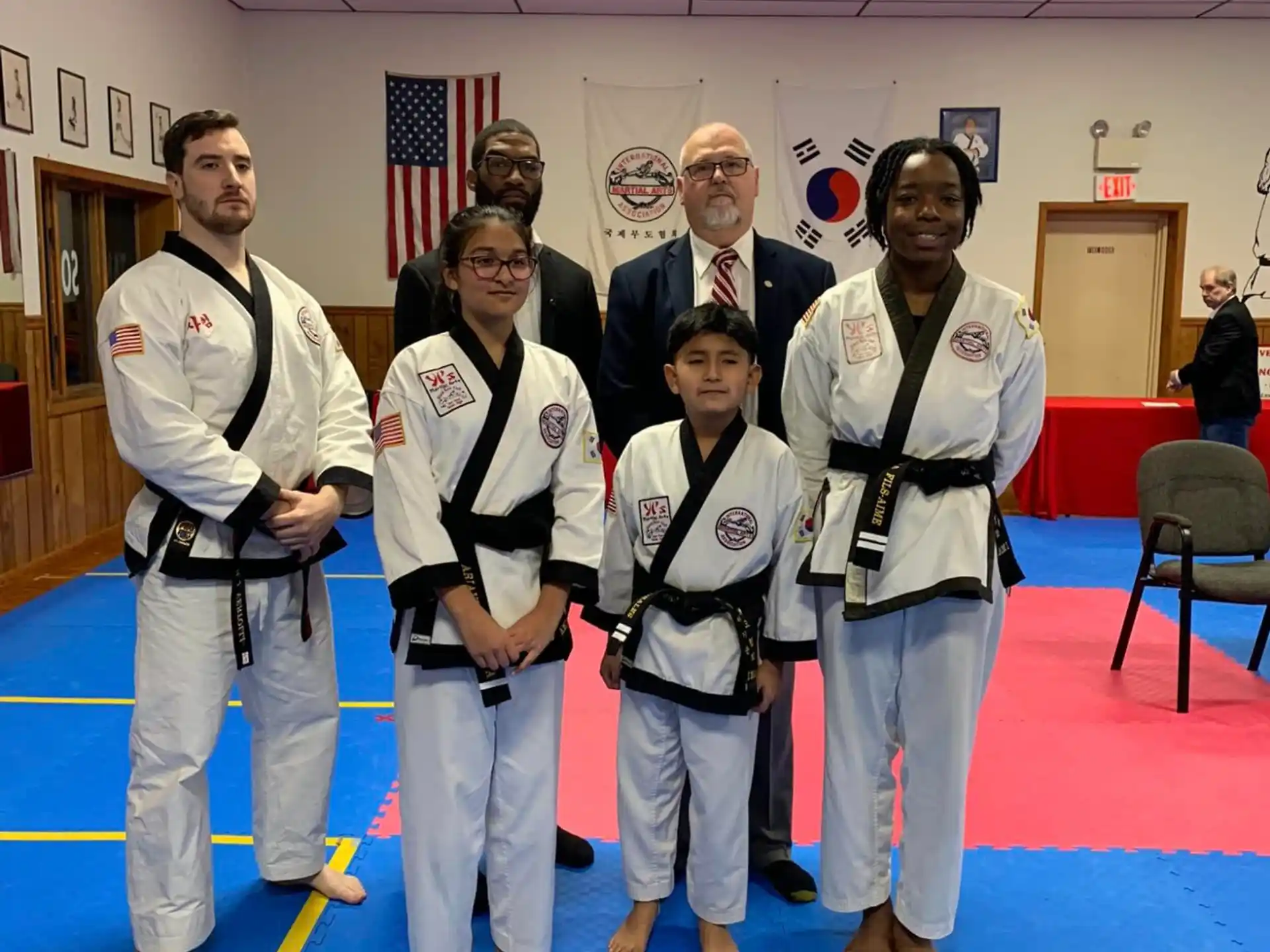 a group of people in karate uniforms