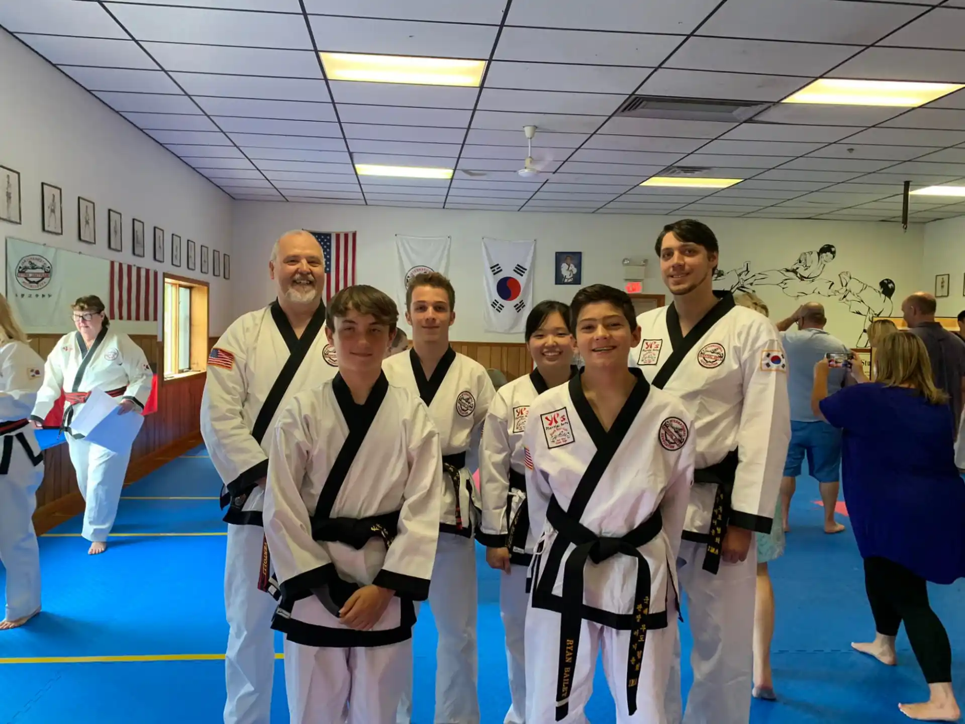 a group of people in karate uniforms