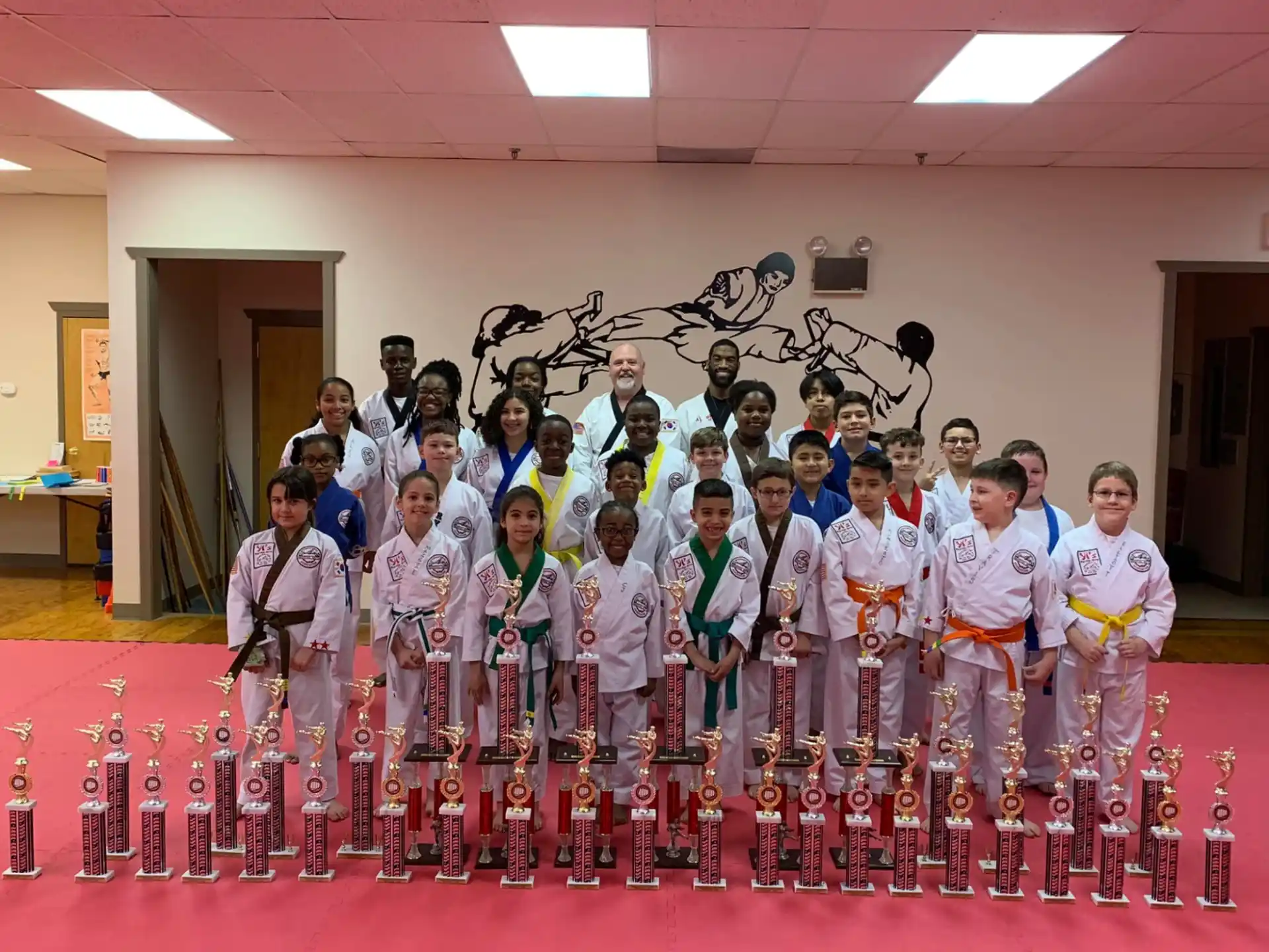 a group of people in karate uniforms