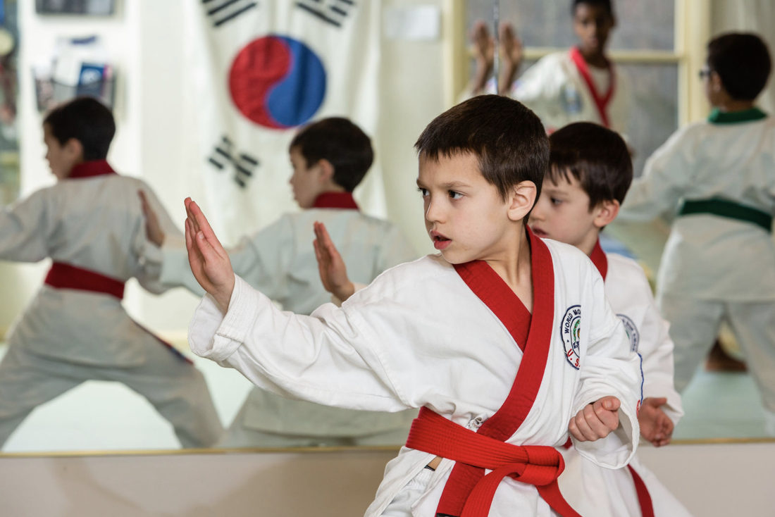 a group of boys in karate uniforms