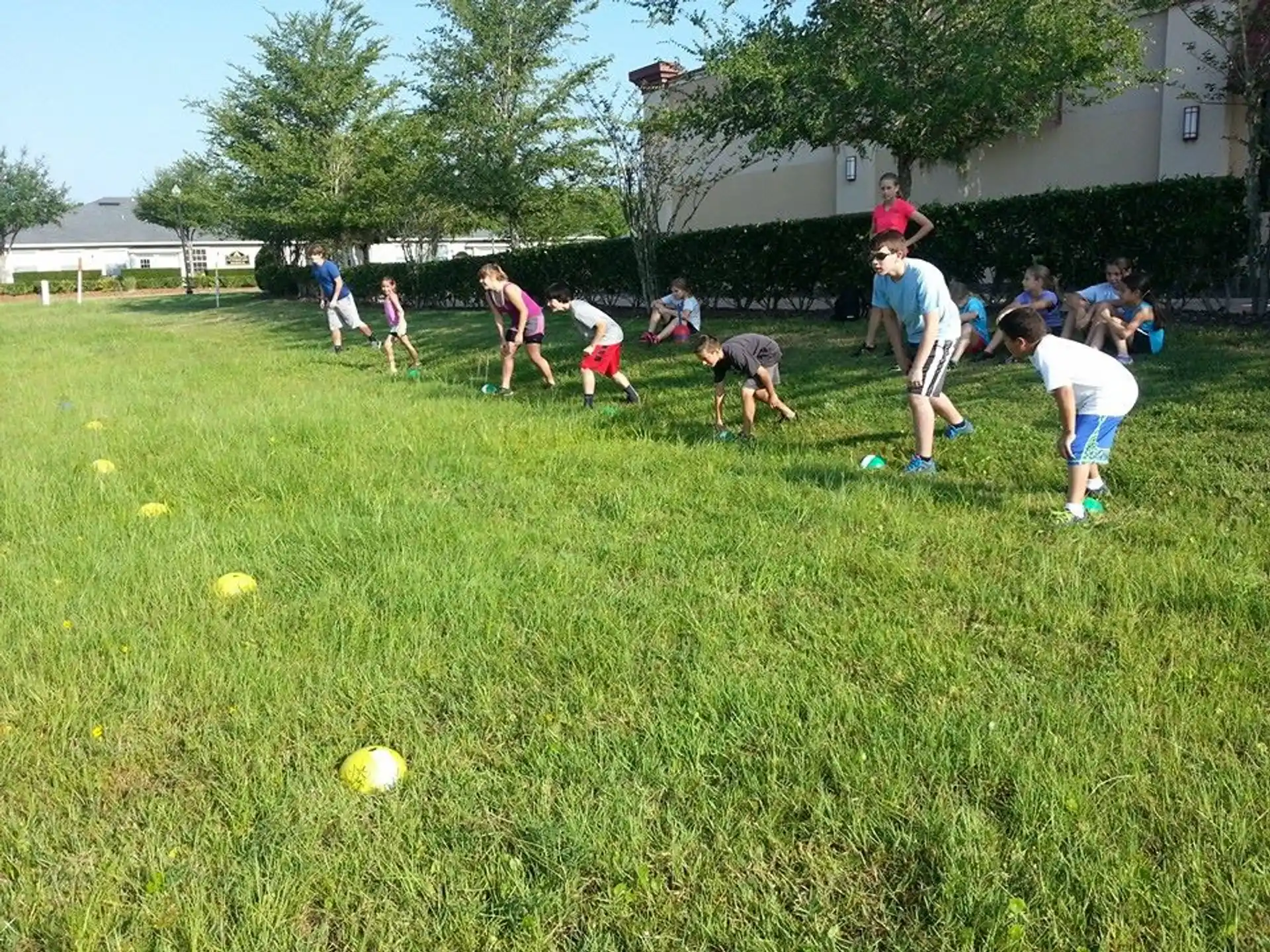 a group of kids playing football