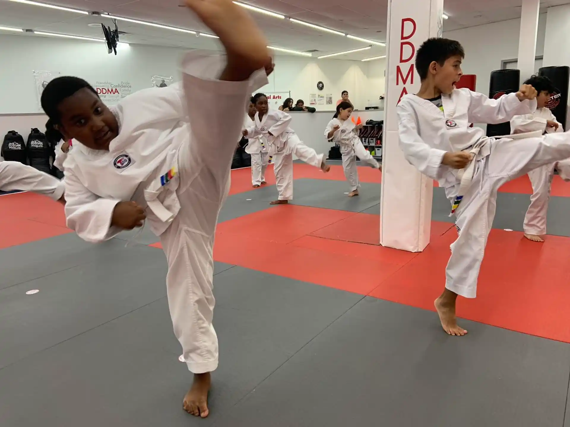 a group of people in karate uniforms