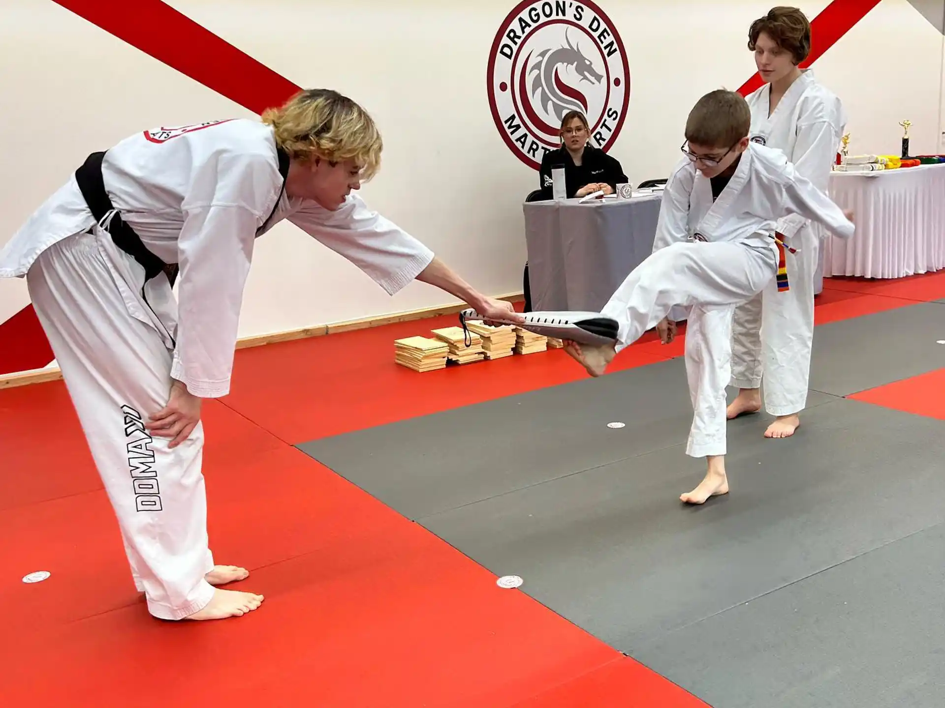 a group of people in karate uniforms