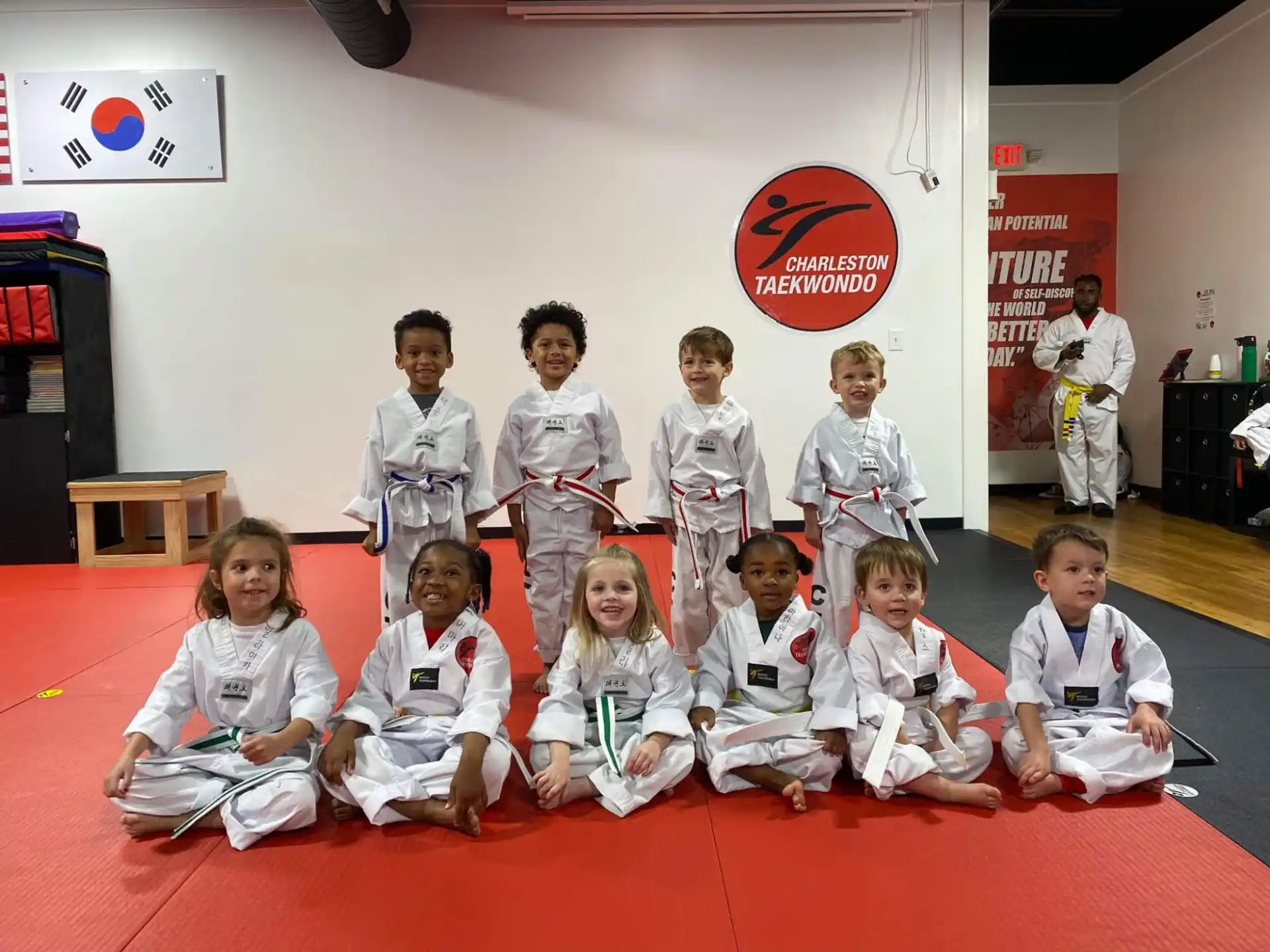 a group of children in karate uniforms